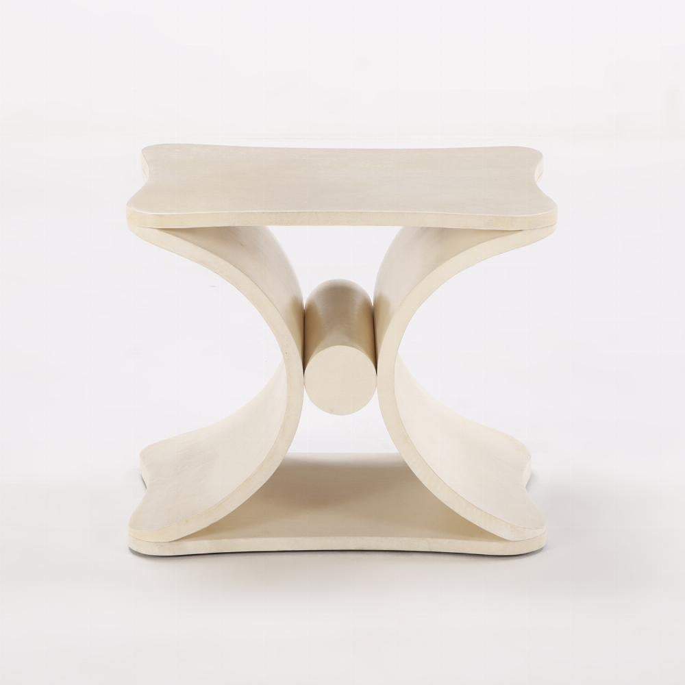 A parchment covered stool or end table in the manner of Jean-Michel Frank.