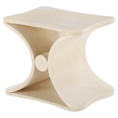 A parchment covered stool or end table