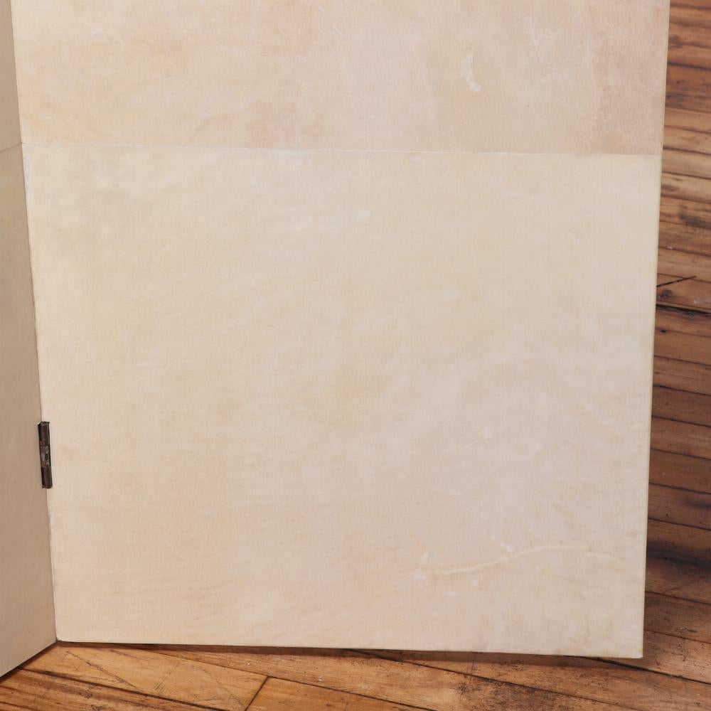 Argentine A parchment covered three panel folding screen.