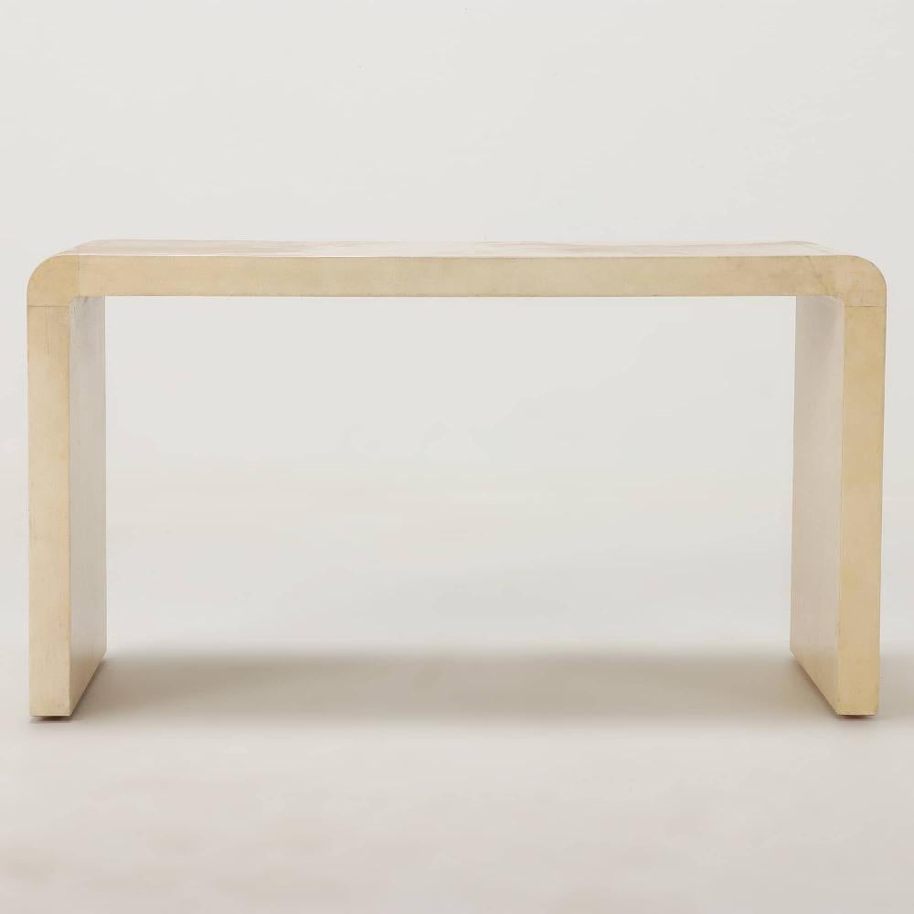 A parchment covered waterfall coffee or end table in the manner of Jean-Michel Frank (1895-1941). Contemporary. The inverted U-form will add a simple and understated elegance to your interiors.
