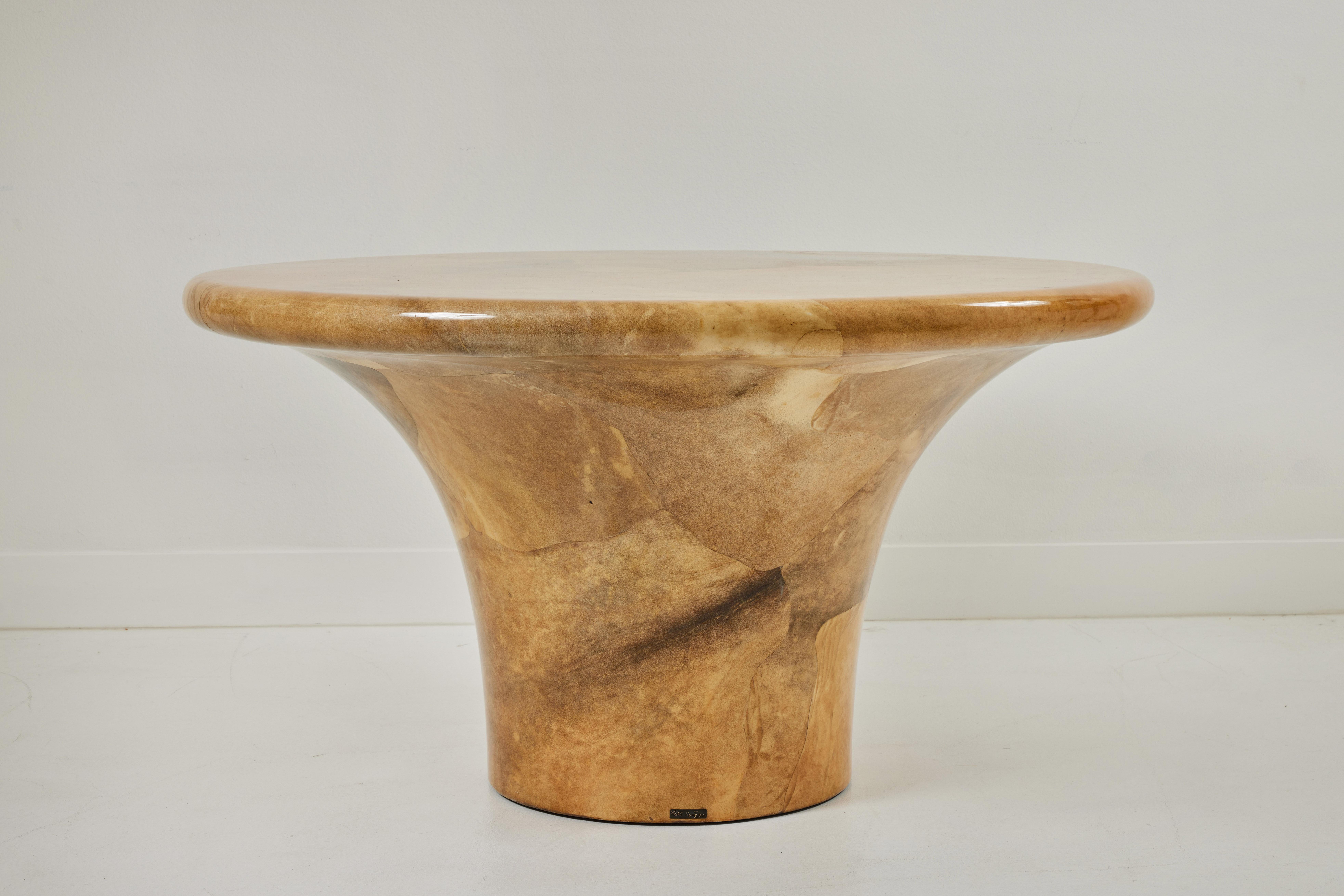 This is a rare and beautiful lacquered goat skin mushroom form table by Karl Springer. The table is signed and dated, 8/79. Although wonderfully suitable for a game table, it can also serve very well as a dining table with a setting for six. This