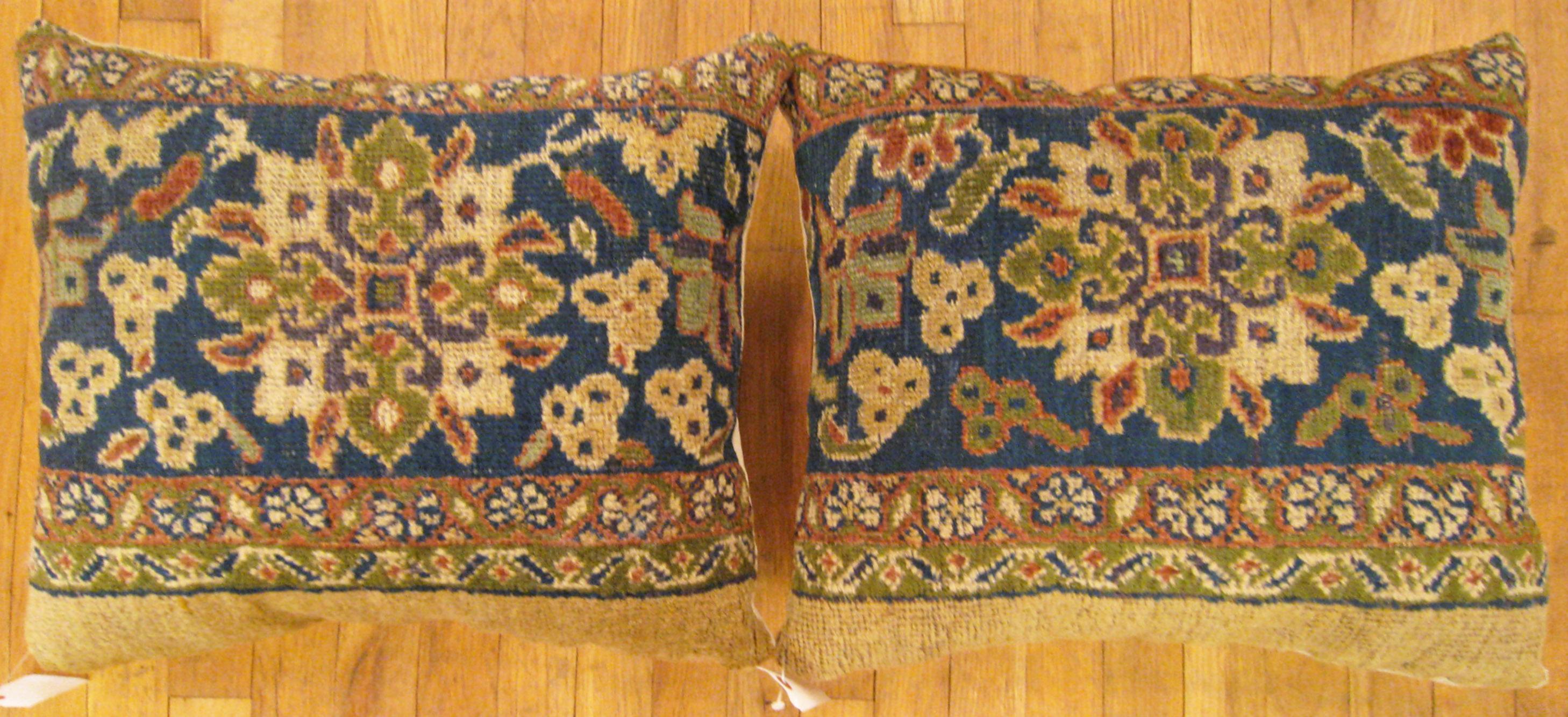 A pair of antique Persian sultanabad carpet pillows ; size 1'10” x 1'6” Each.

An antique decorative pillows with floral elements allover a camel central field, size 1'10” x 1'6” each. This lovely decorative pillow features an antique fabric of a