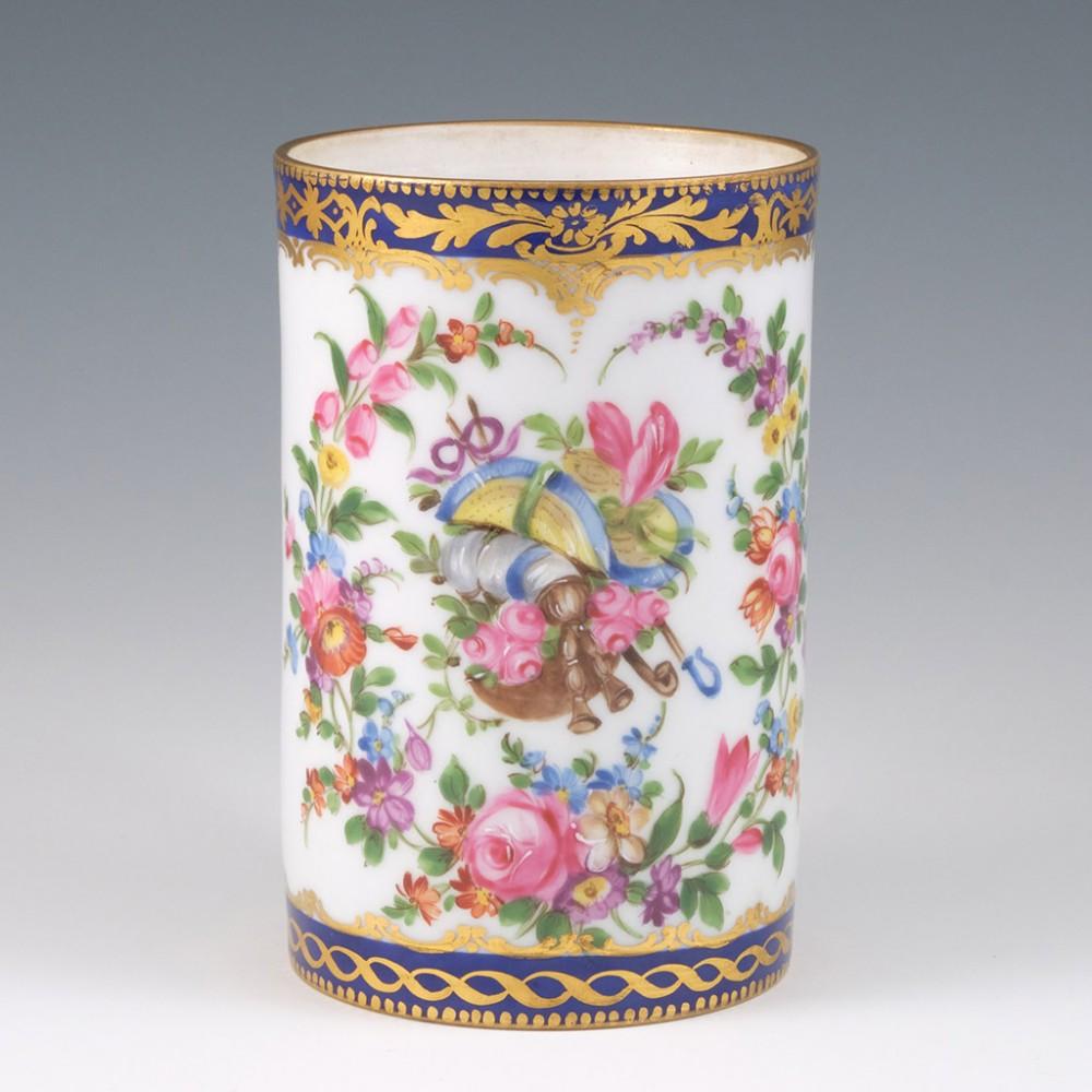 Heading : A floral decorated Paris porcelain mug
Date : 1850-1880
Marks : None
Origin : Paris
Colour : Gilded cobalt blue bands above and below polychrome flowers
Condition : Very good, the glaze is a little thin below the rim
Restoration :