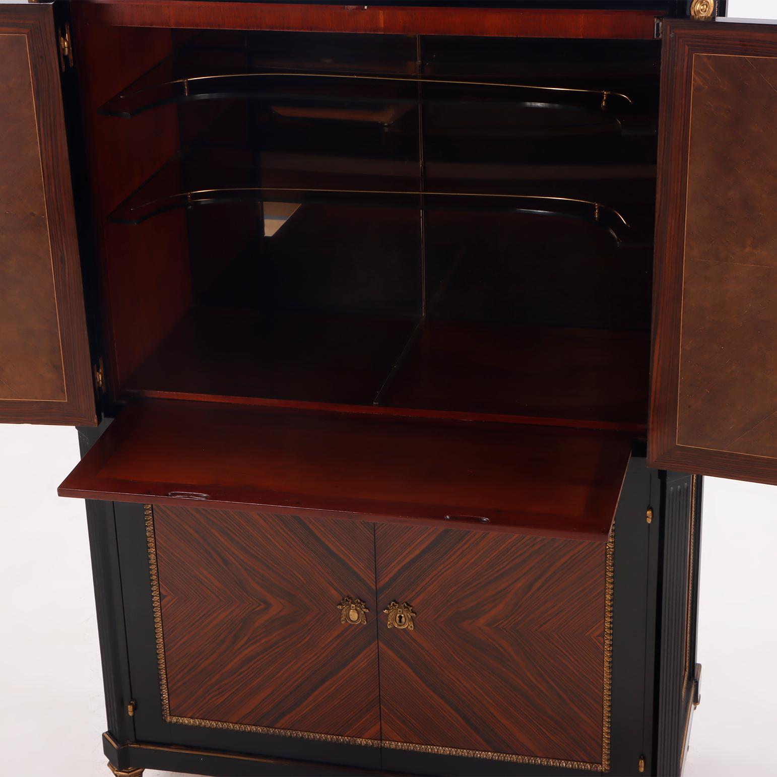 Mid-Century Modern A partial ebonized four door bar cabinet in the manner of Jansen circa 1940. For Sale