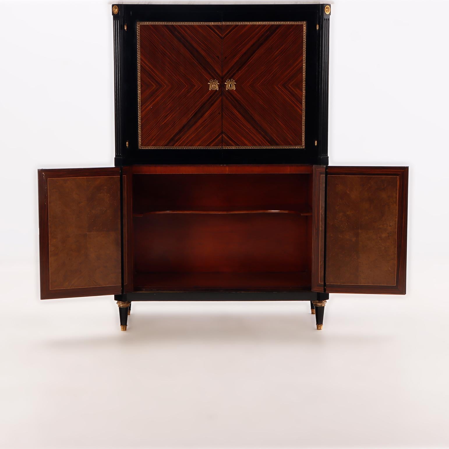 Ebonized A partial ebonized four door bar cabinet in the manner of Jansen circa 1940. For Sale