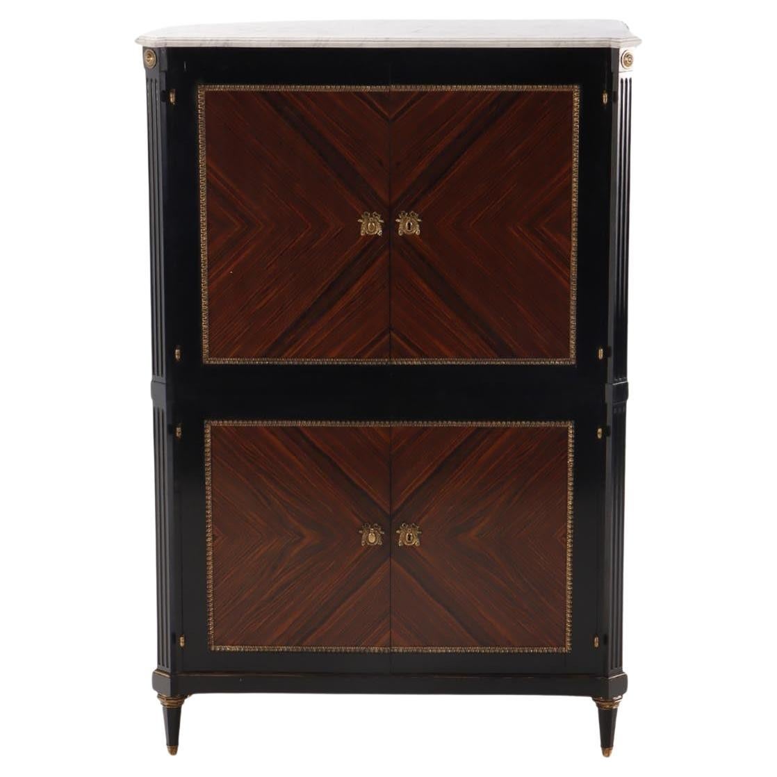 A partial ebonized four door bar cabinet in the manner of Jansen circa 1940. For Sale