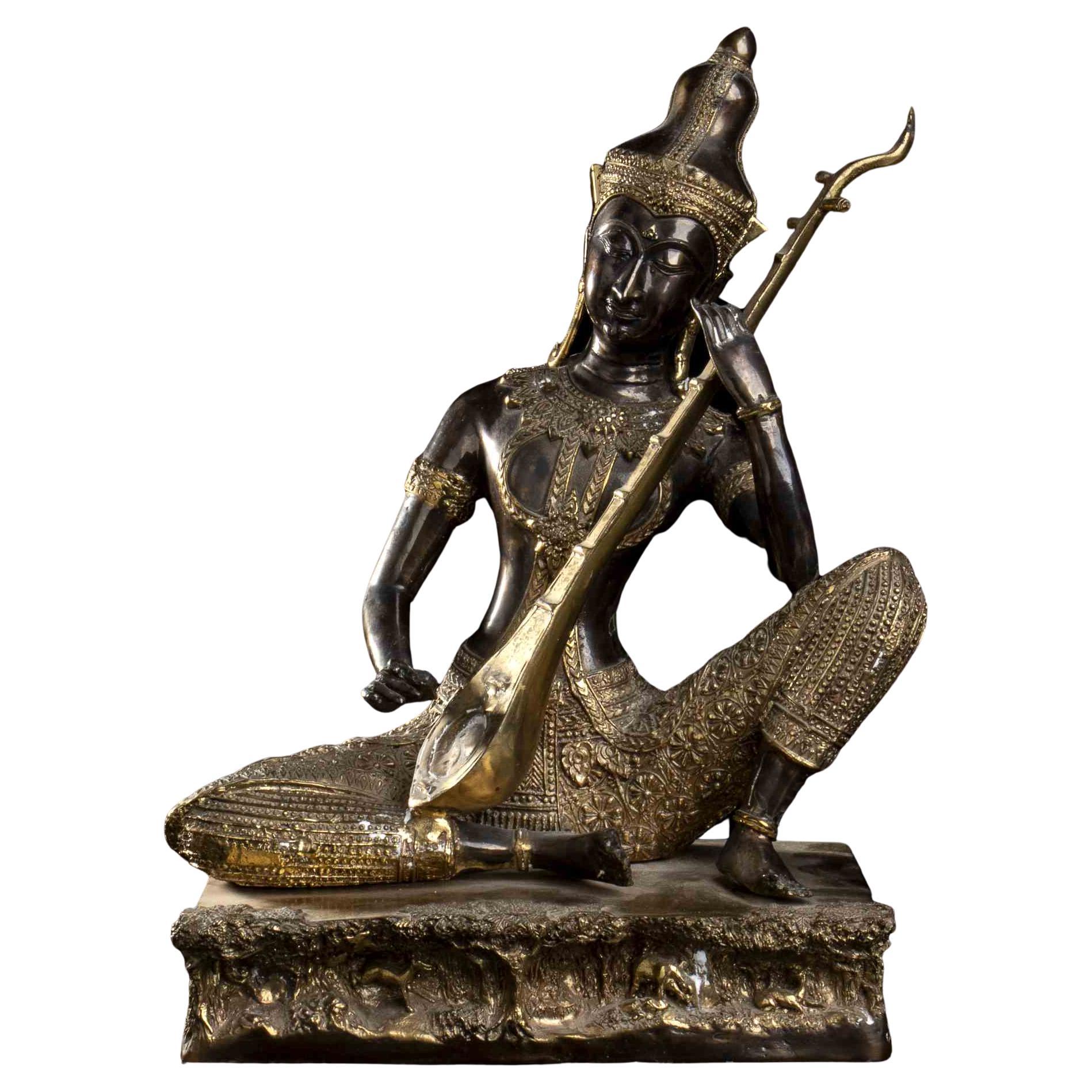 A Partially Gilt Asian Sculpture of Musician, Early 20th Century