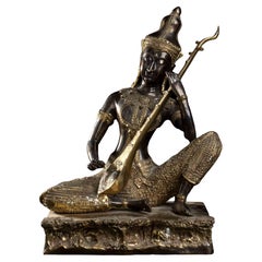 A Partially Gilt Asian Sculpture of Musician, Early 20th Century