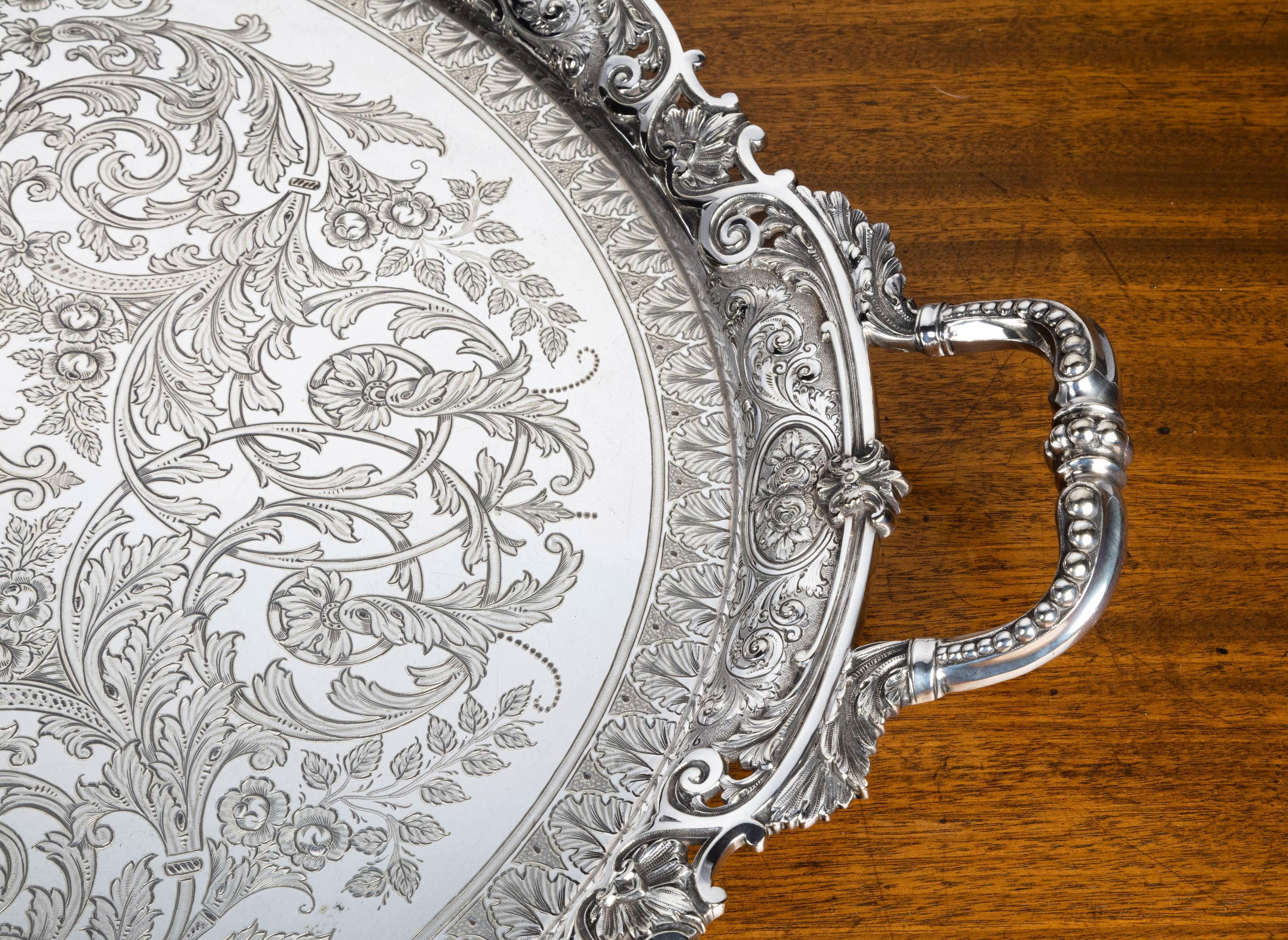 A particularly fine quality, large oval tray. With a very finely cast and chiselled outer border and deeply engraved to the centre sections.