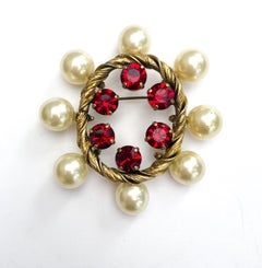 A paste, faux pearl and ruby paste oval brooch, Christian Dior , Germany, 1960.