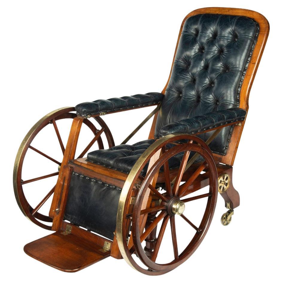 A patented mechanical campaign invalid chair by Chapman For Sale