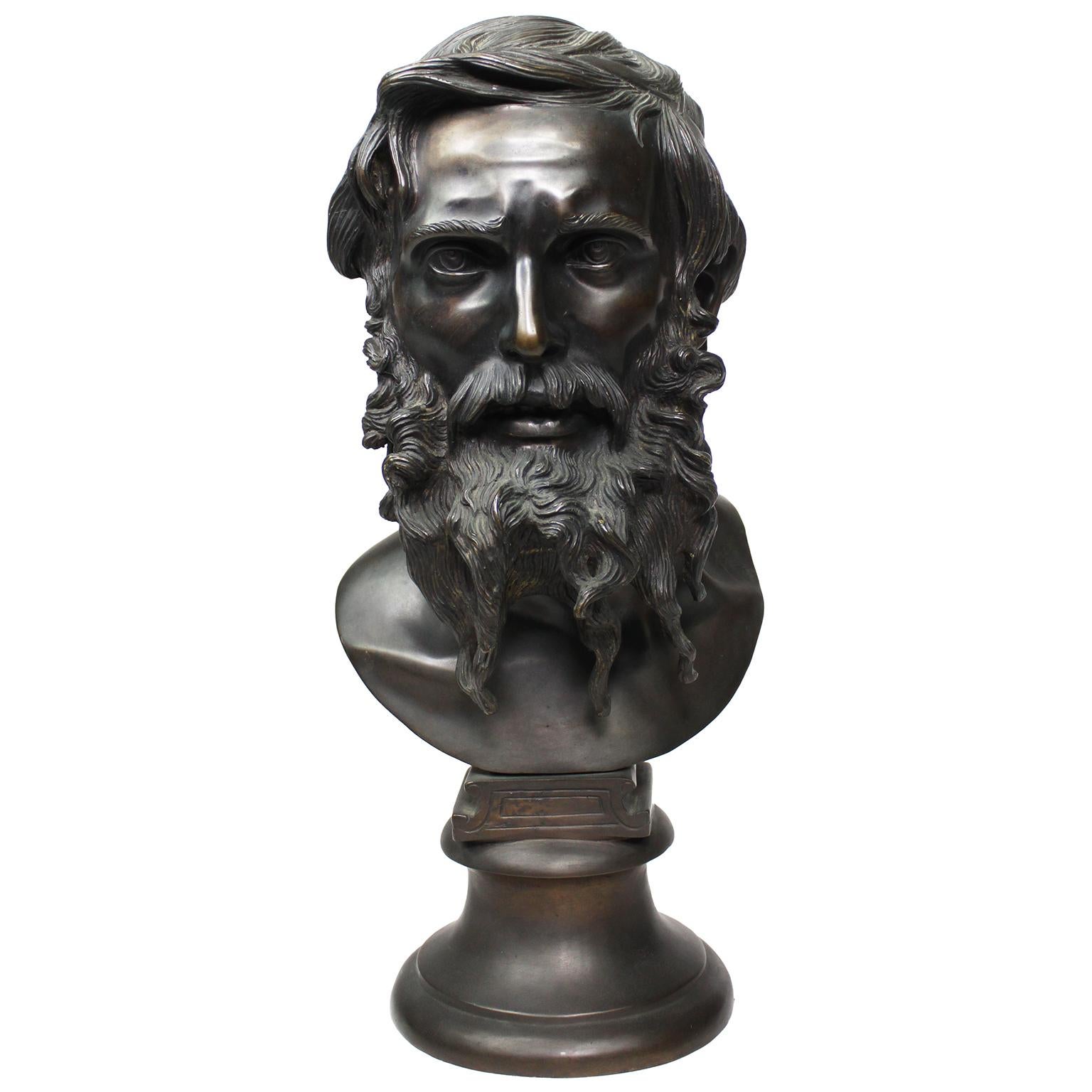 A Fine Italian 19th Century Bronze Bust Figure of Il Filosofo (The Philosopher), cast from a model by Vincenzo Gemito, depicting an elder bearded man with a straight gaze, fitted on a circular stand. Signed GEMITO and some markings. Circa: Naples,