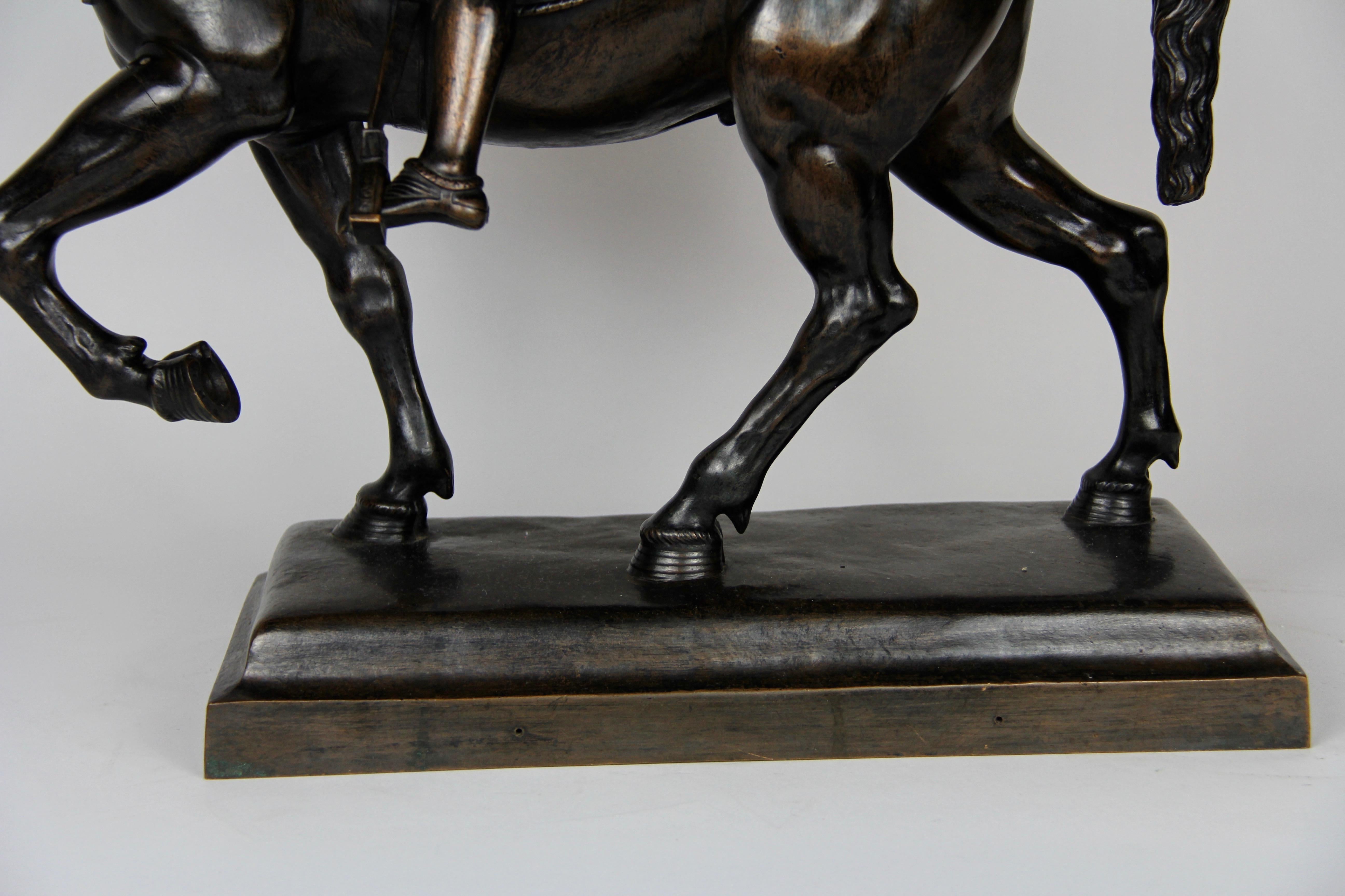 Patinated Bronze Figure of a Soldier on a Horse with a Helmet For Sale 9