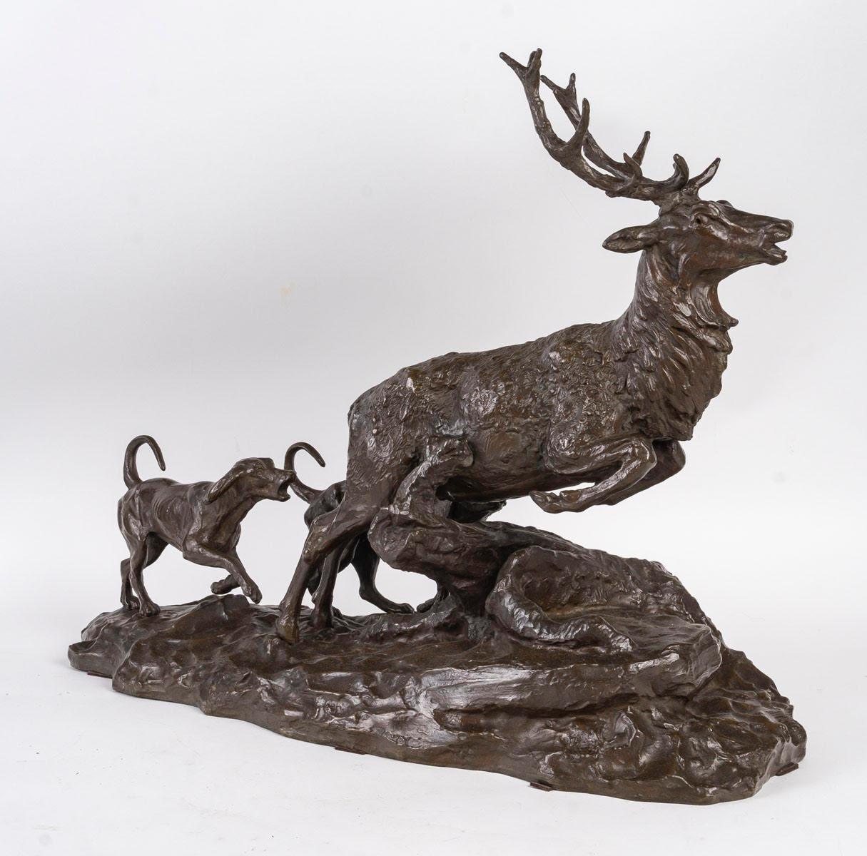 A patinated bronze sculpture of a stag and hunting dogs, 19th century.

Sculpture by A.Laplanche in patinated bronze representing a stag and hunting dogs, 19th century.
H: 49cm, W: 65cm, D: 27cm