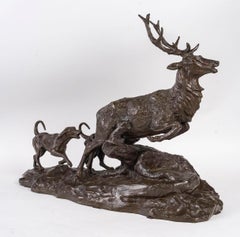 A Patinated Bronze Sculpture of a Stag and Hunting Dogs, 19th Century.
