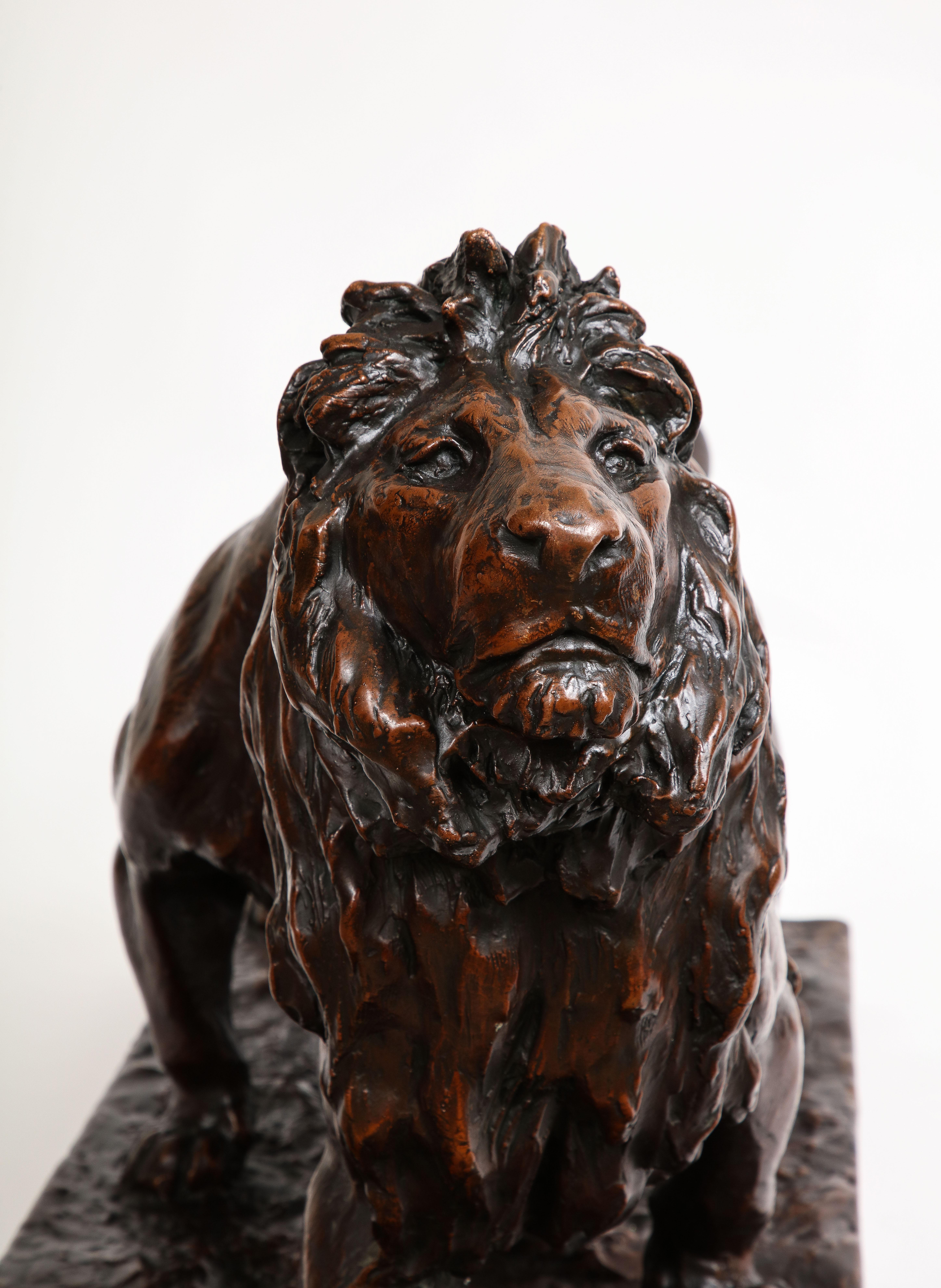 A Patinated Bronze Sculpture of Two Striding Lions, Signed By the Artist For Sale 5