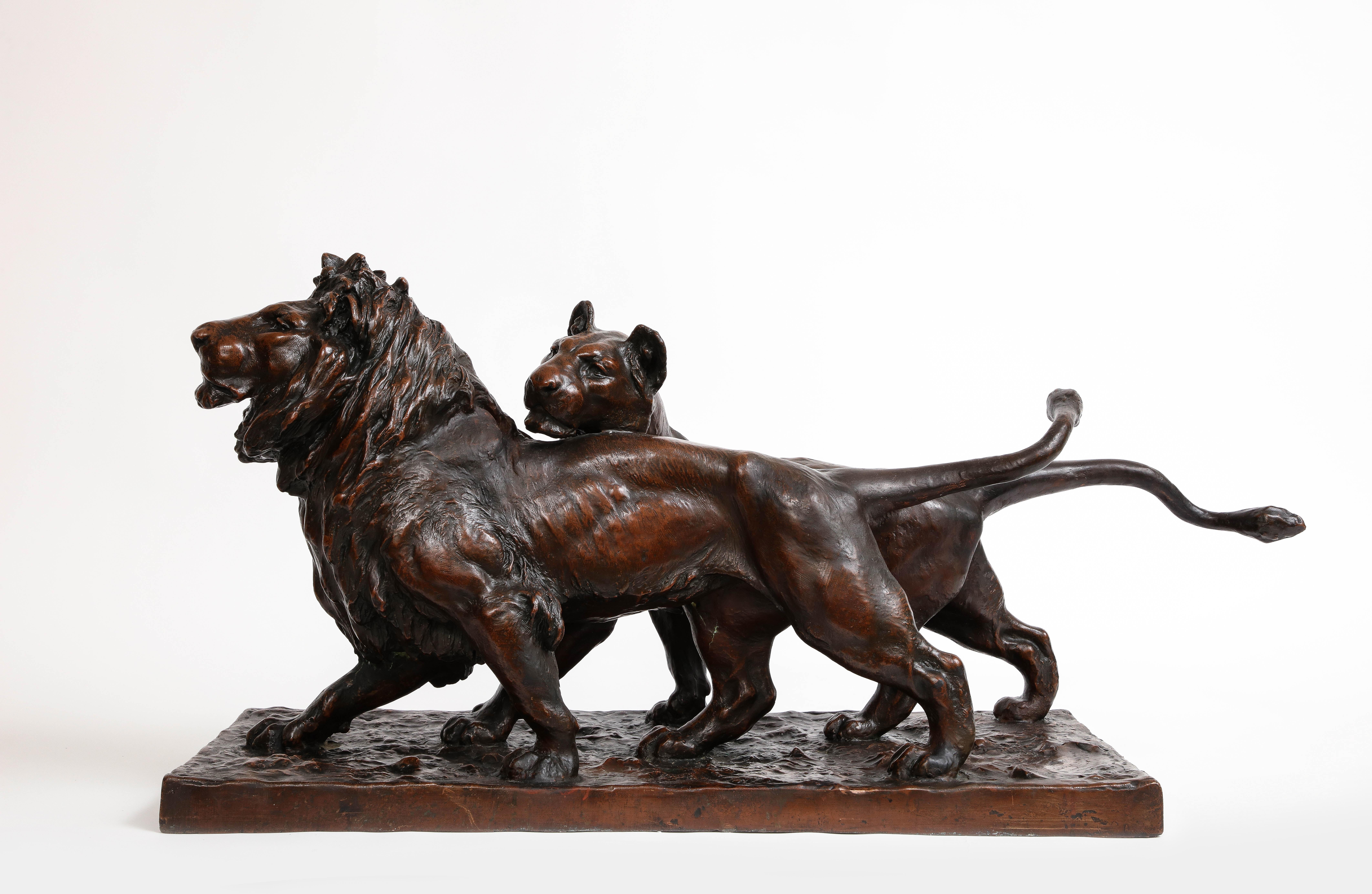 A Patinated Bronze Sculpture of Two Striding Lions, Signed By the Artist

Witness the awe-inspiring spectacle of this extraordinary antique bronze masterpiece, painstakingly hand-carved and adorned with the artist's signature. Prepare to be