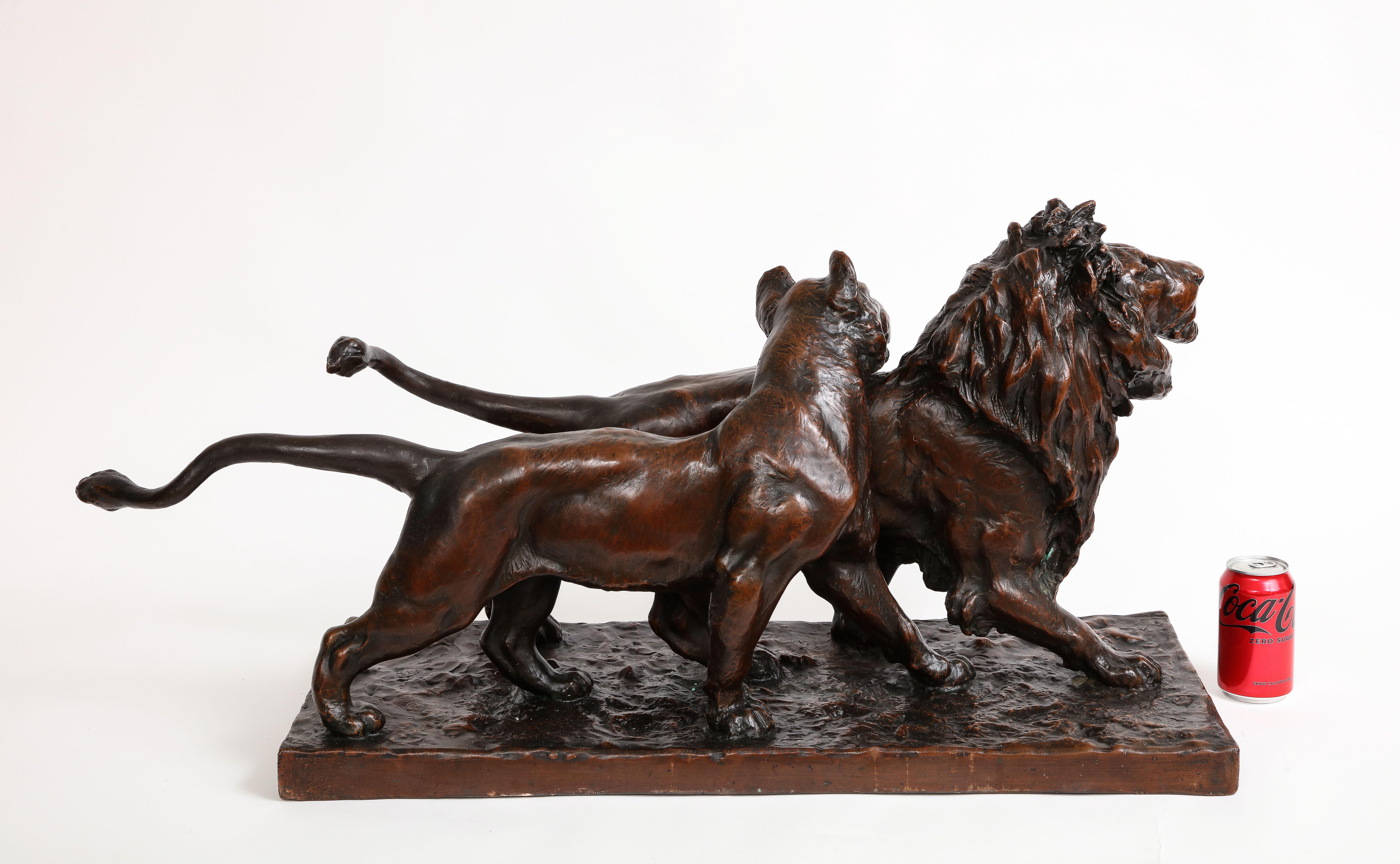French A Patinated Bronze Sculpture of Two Striding Lions, Signed By the Artist For Sale