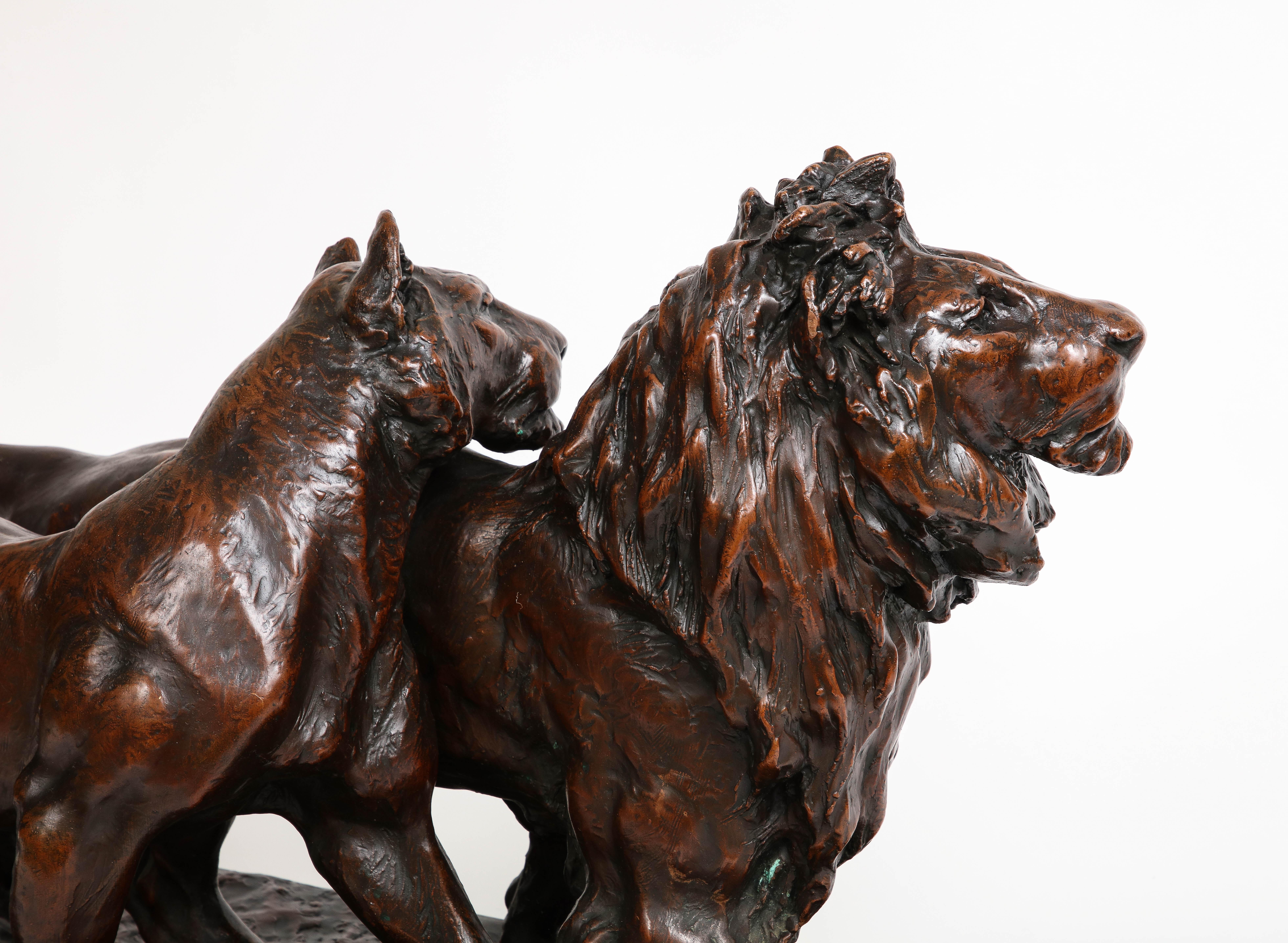 Late 19th Century A Patinated Bronze Sculpture of Two Striding Lions, Signed By the Artist For Sale