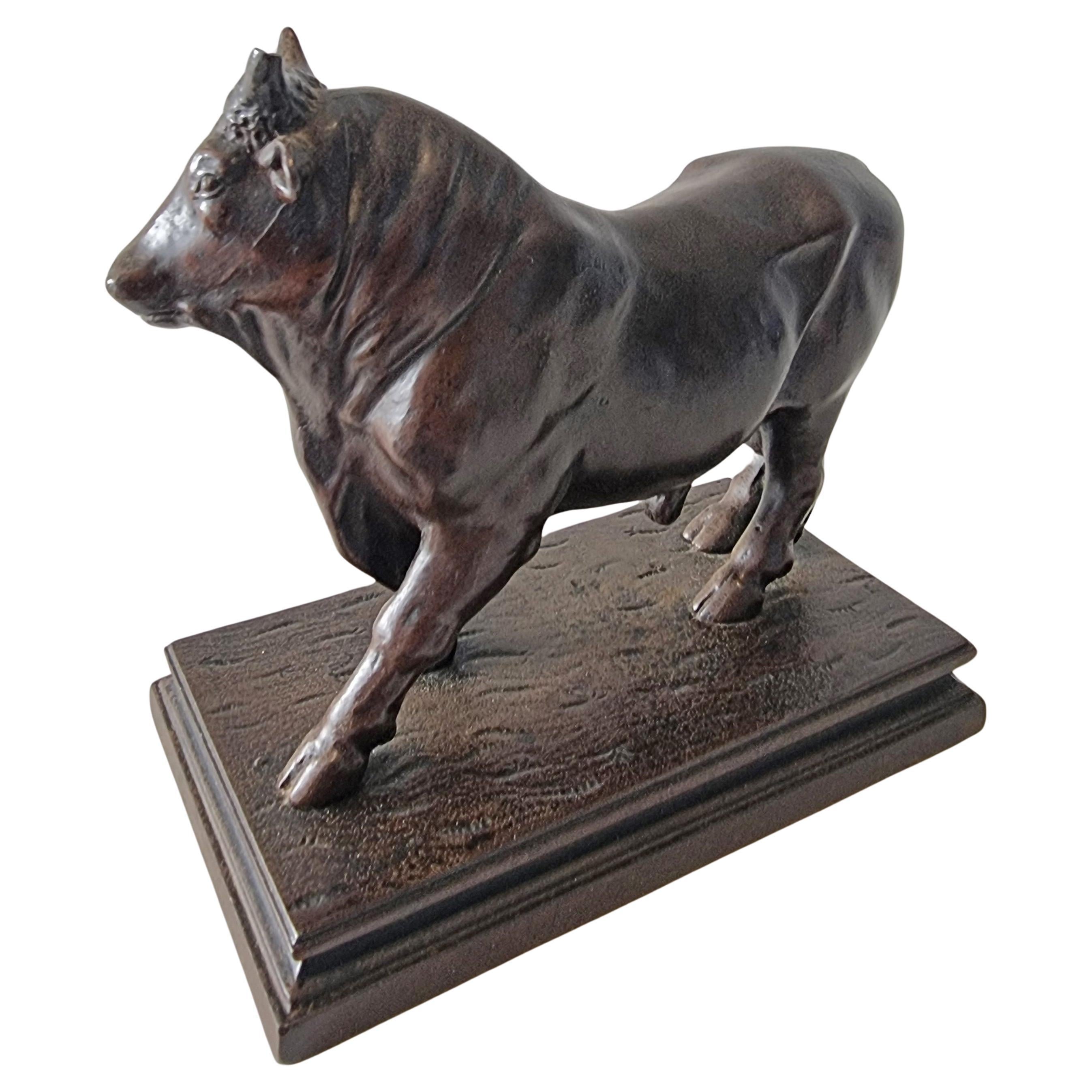 A Patinated Iron Sculpture of a Bull For Sale