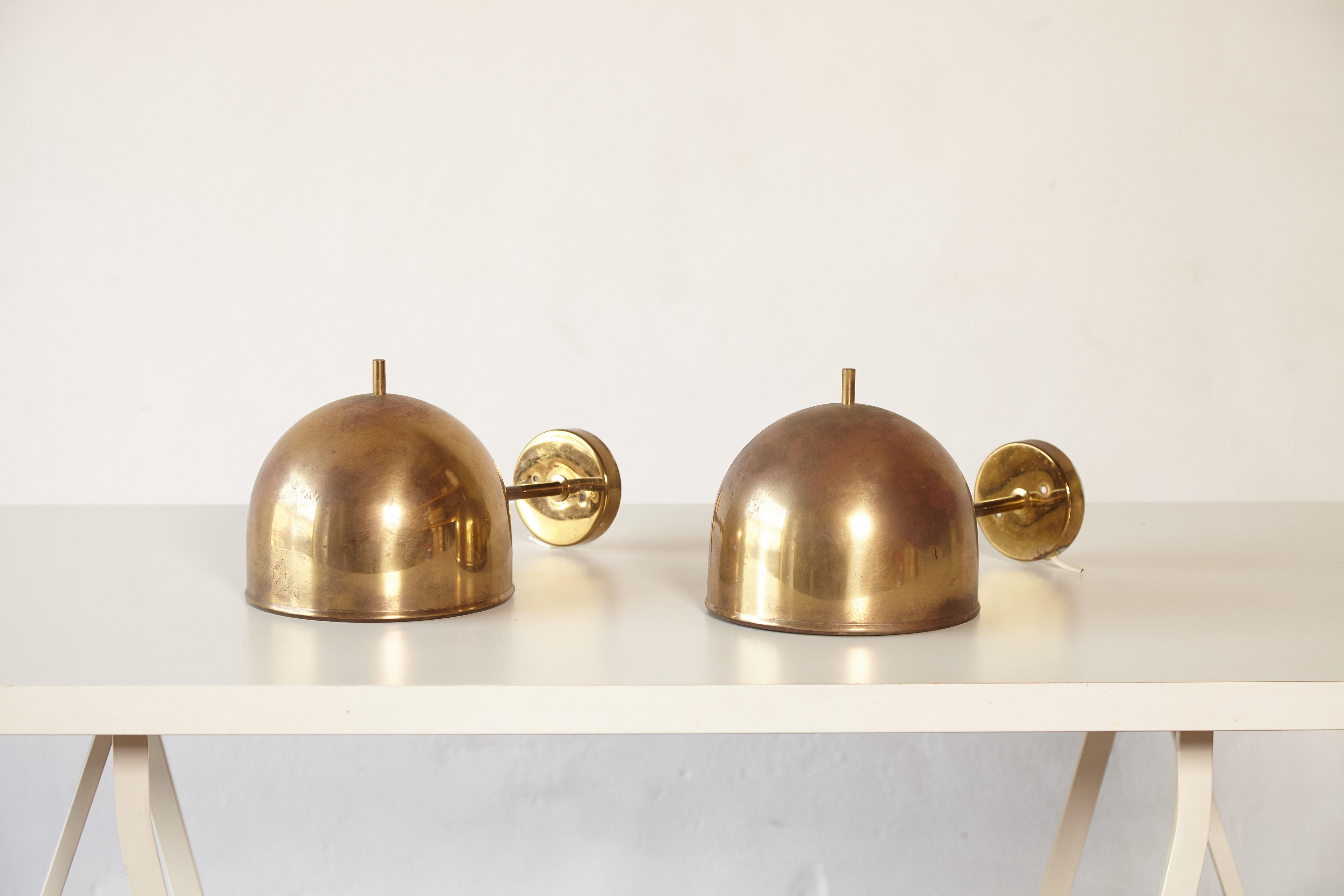 A super patinated pair of brass wall lamps, model G-075, Bergboms, Sweden, 1960s. Priced and sold as a pair.