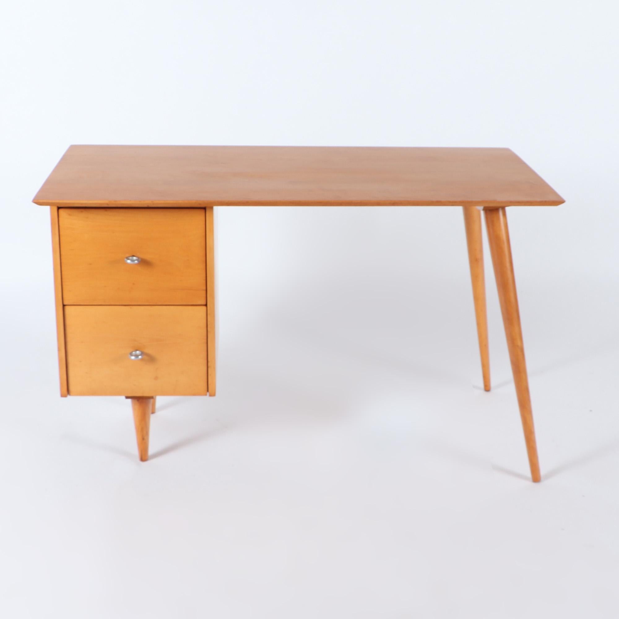 A Paul McCobb Planner Group For Wichedon mid century modern maple desk model 1560, labeled on underside, circa 1960.