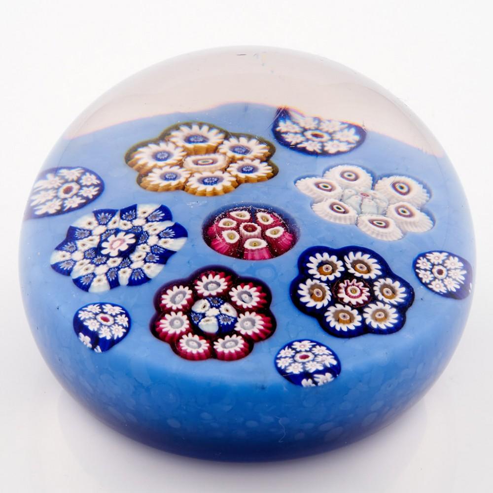 A Paul Ysart Rondel Millefiori Paperweight, c1930's

Additional information:
Date : Pre war Moncrieff  1930's
Origin : Moncrieff, Scotland
Features : Rondel comprising five groups of canes, one central cane interspersed with five perimeter