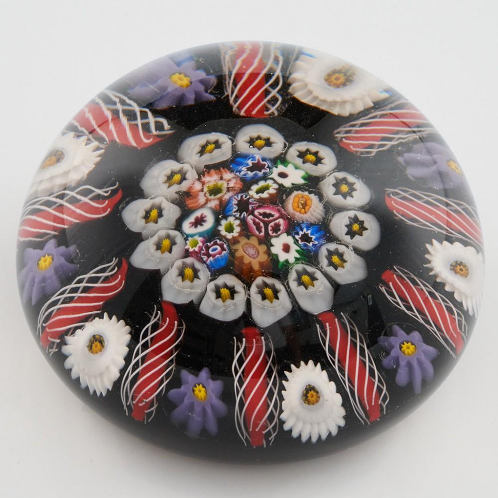 Heading : A Paul Ysart Ten Spoke Radial Close Packed Paperweight c1950
Date : c1950
Origin : Scotland
Features : Ten polychrome radials interspersed with alternate canes around a single concentric ring with inner close packed canes
Marks : none
Type