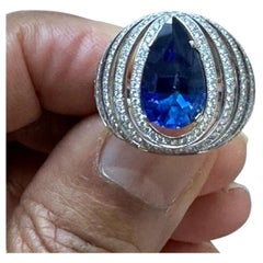 A 5.76 carat SSEF ceritified Burma No Heat mounted with diamond Ring