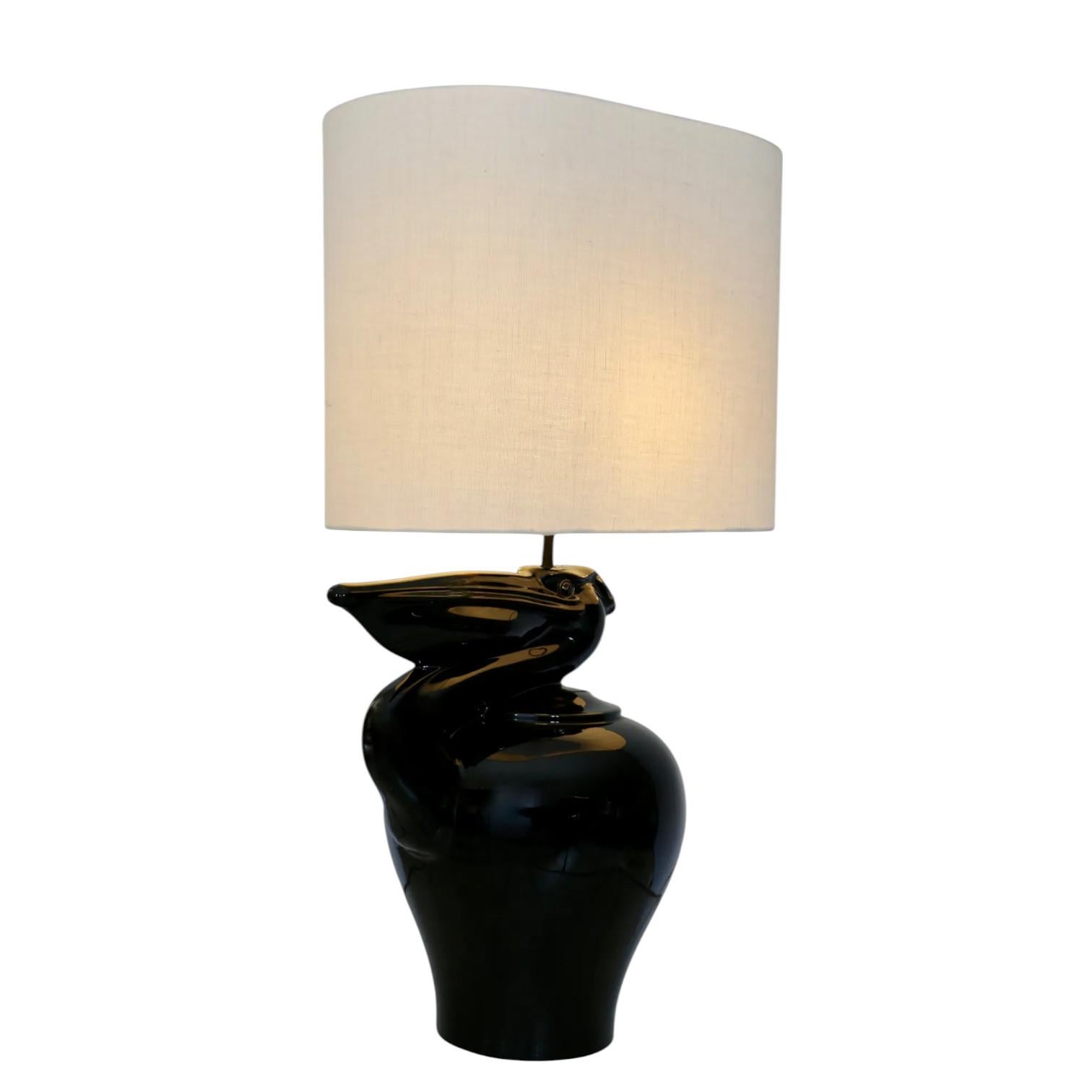A large black ceramic lamp depicting a pelican. France 70s.