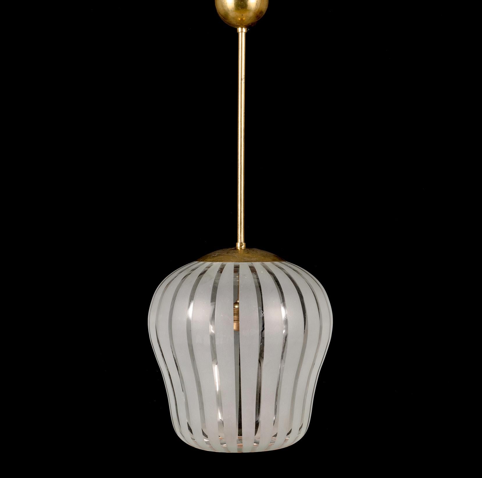 A pendant designed by Gunnel Nyman, nr 82504, Idman, Finland 1950s. 
Brass shaft, glass shade partially frosted glass, brand plaque, height 35, diameter 34 cm. Total height circa 85 cm.
Similar example featured at Idman catalog No140.
Rewiring