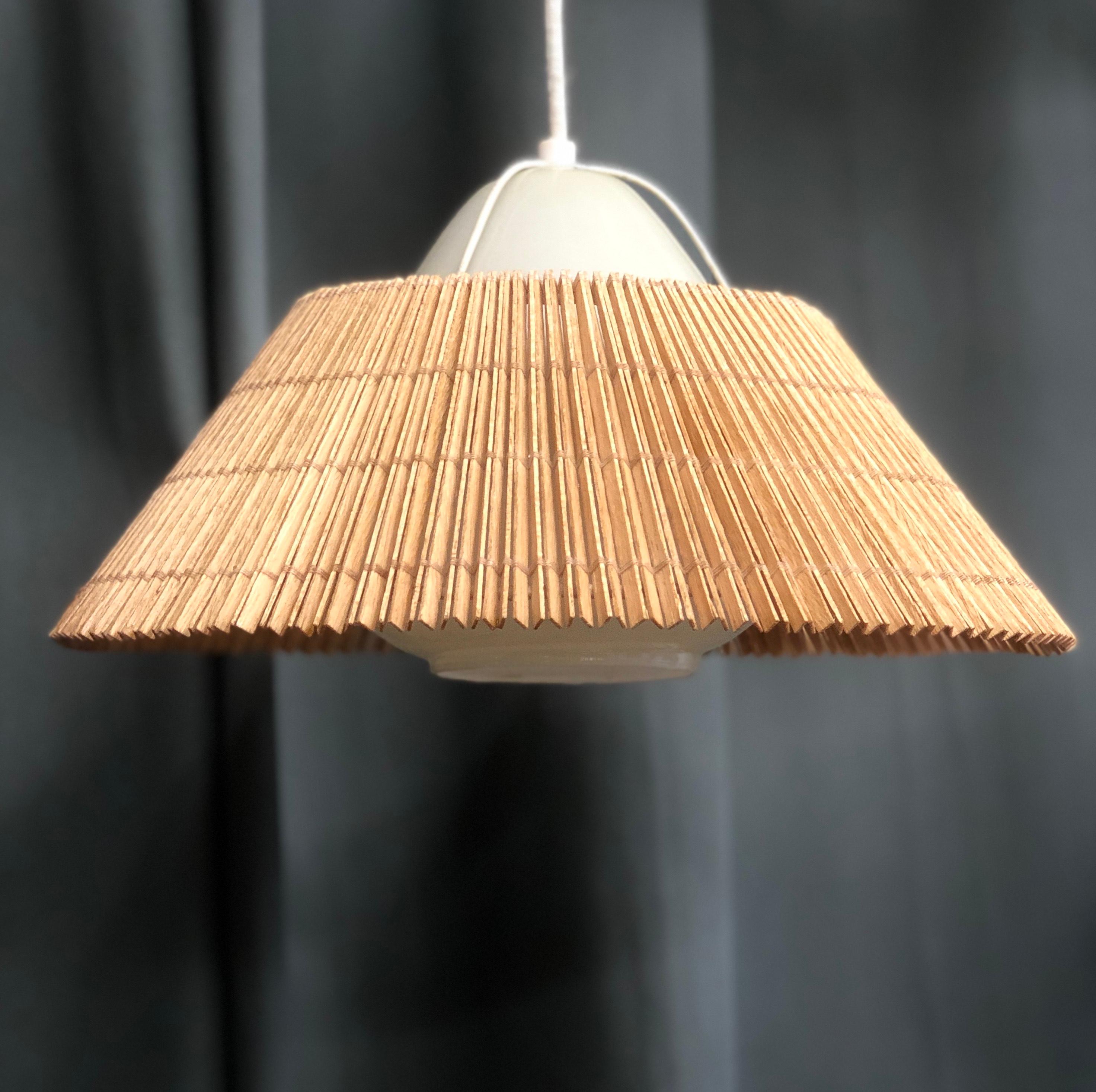 A vintage pendants designed by Lisa Johansson-Pape for Orno, Finland , Circa 1950th. Opaline glass defusers with wooden stripes shades.
Existing wires, rewiring available upon request. 2 fixtures available. Price is for each.