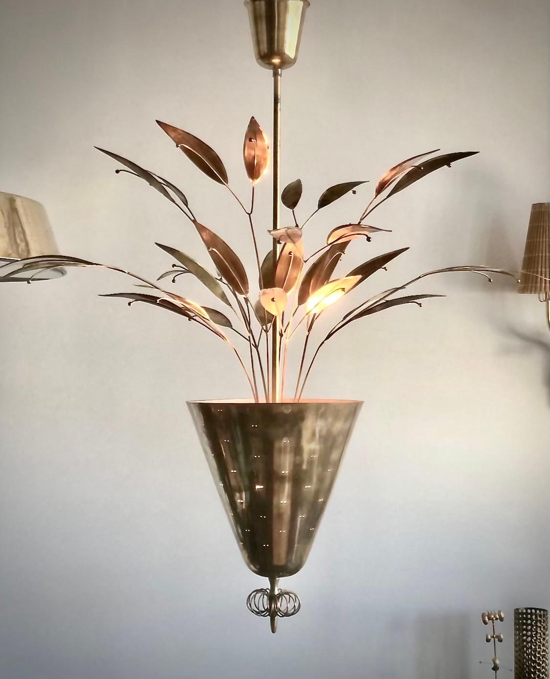 
Custom commissioned lighting pendant designed by Paavo Tynell for Taito, Oy. Finland circa 1940th/50th.
Polished perforated brass with brass leafs decoration. (2) E 27 sockets. Rewiring available upon request.
Stamped Taito. H 36