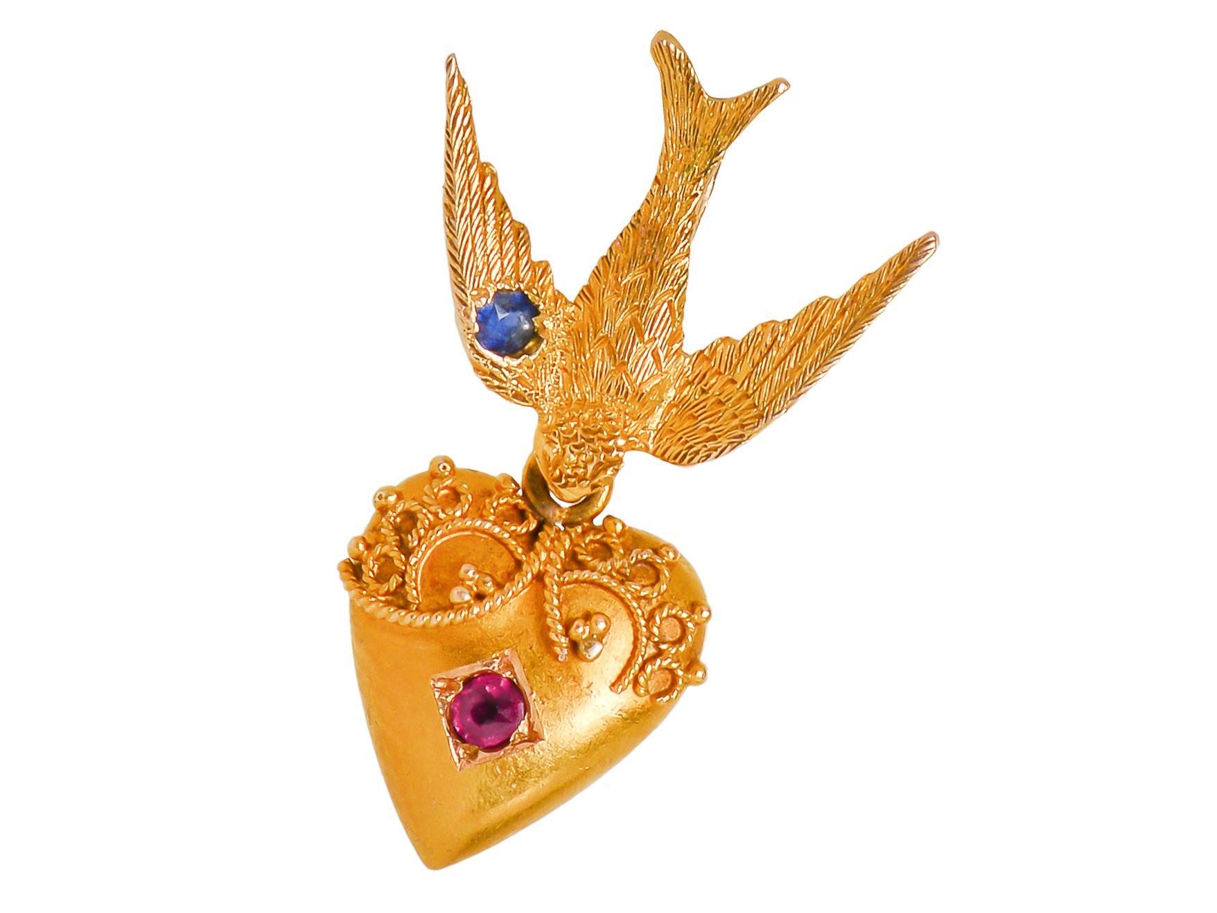In 18 Kt gold set with a ruby and a sapphire this pendant is reminiscent of Shakespeare's poem 