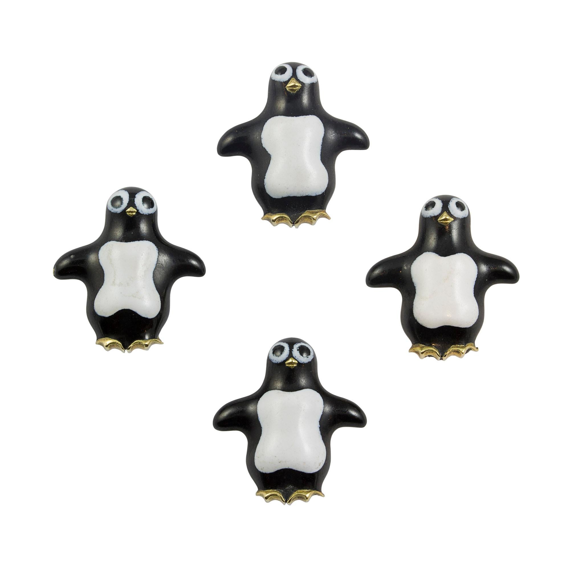 A penguin dress set, the pair of black and white enamel penguin cufflinks accompanied by four matching buttons, all mounted in yellow gold, hallmarked 18ct gold, London 2009, bearing the Bentley & Skinner sponsormark, the large links measuring