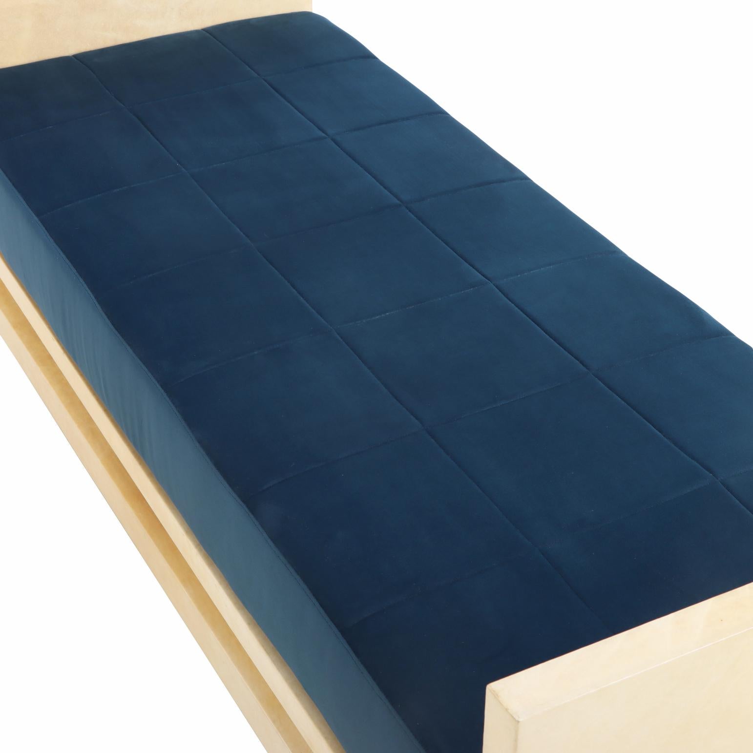 A sophisticated daybed / bench crafted in three components and fully wrapped in warm-toned Pergamino parchment.  This piece combines minimalist geometry with luxurious natural texture. The parchment’s subtle tonal variations and smooth matte finish