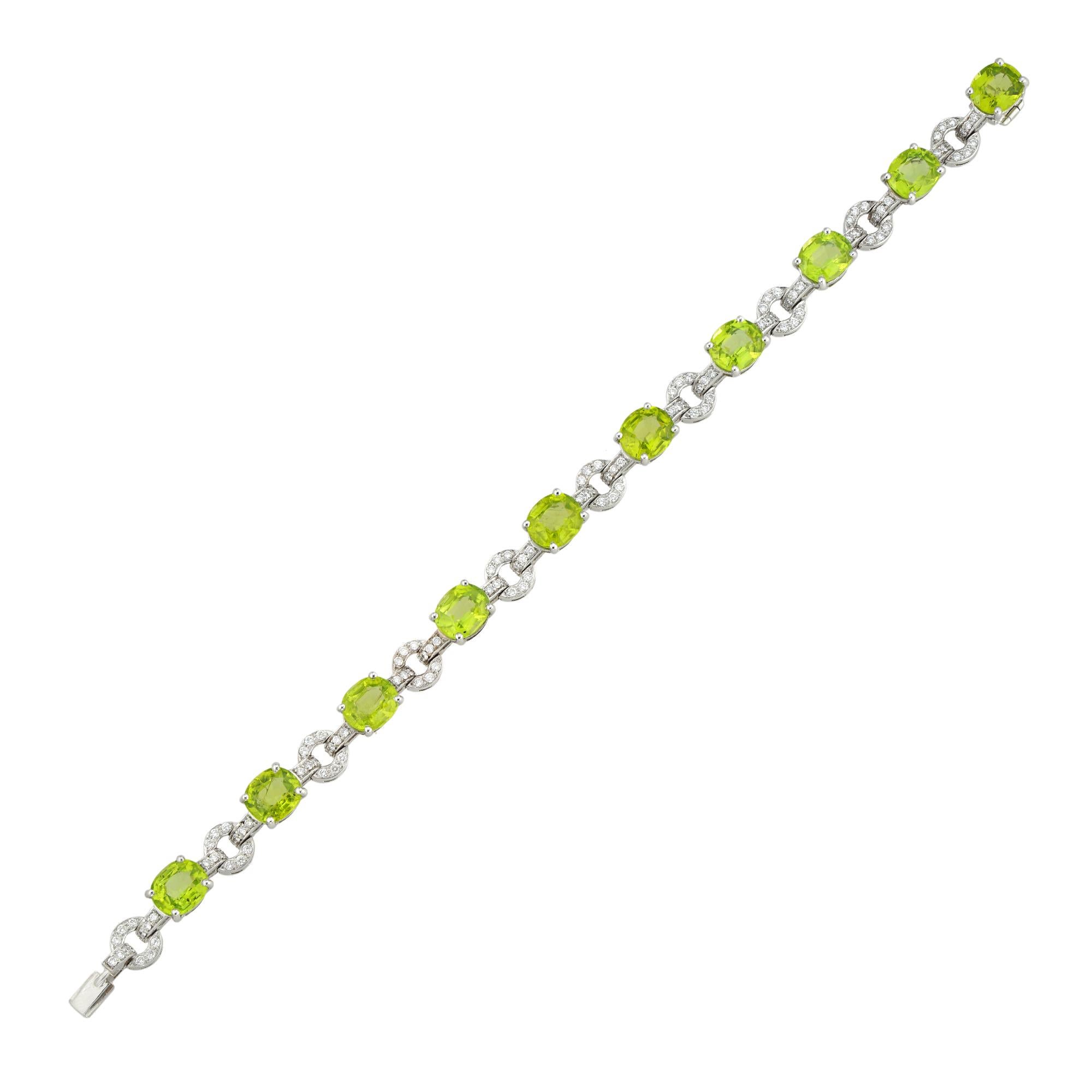 A peridot and diamond bracelet, the ten oval-shaped faceted peridots weighing 18.54 carats in total, all four-claw set to white gold collects, connected with circular diamond-set links, the hundred and forty small round brilliant-cut diamonds