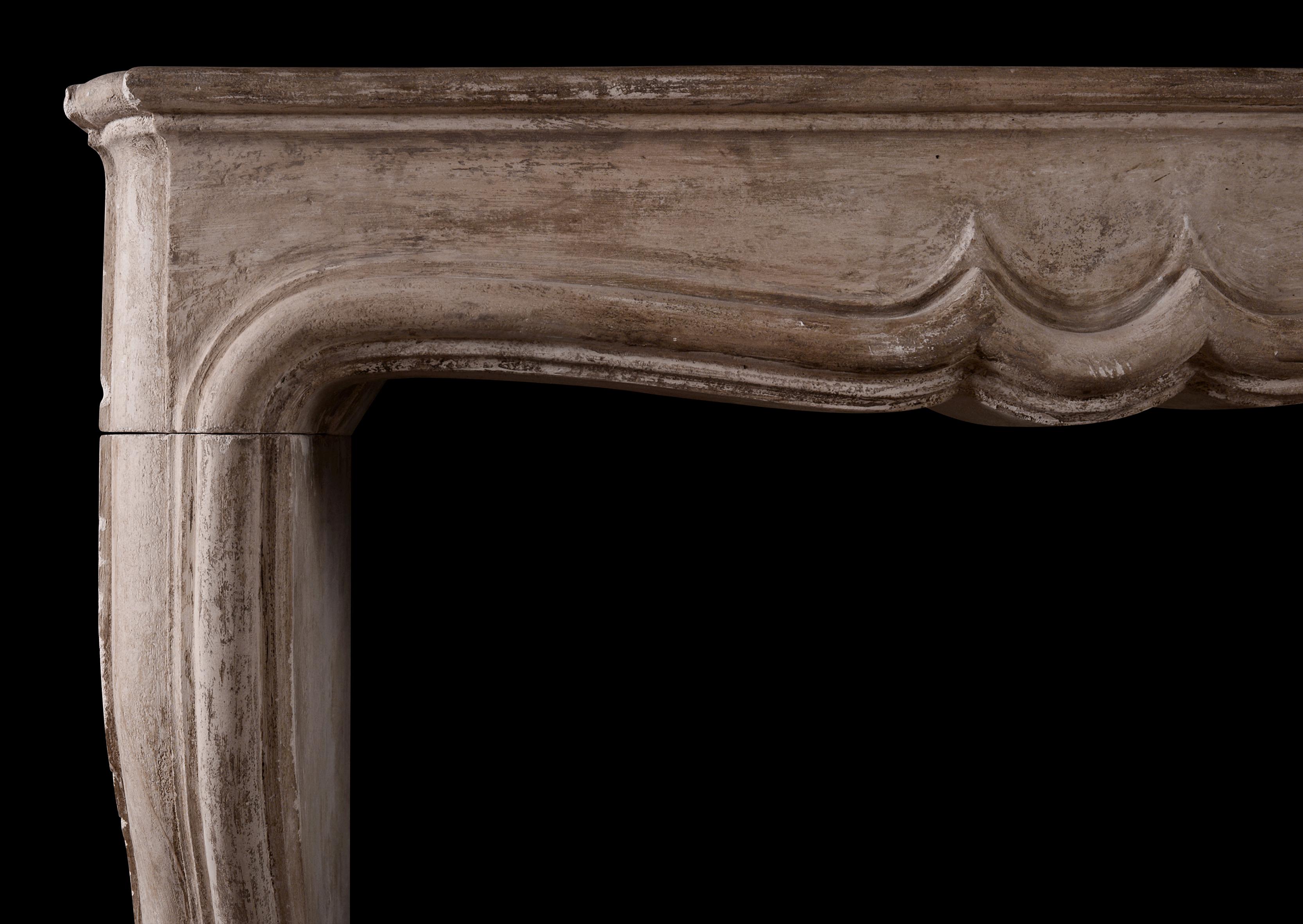 A period 18th century French Louis XIV stone fireplace. The moulded jambs surmounted by elegantly shaped frieze and shelf. Still at original depth, but could be reduced if necessary.

Measures: Shelf width: 1405 mm 55 