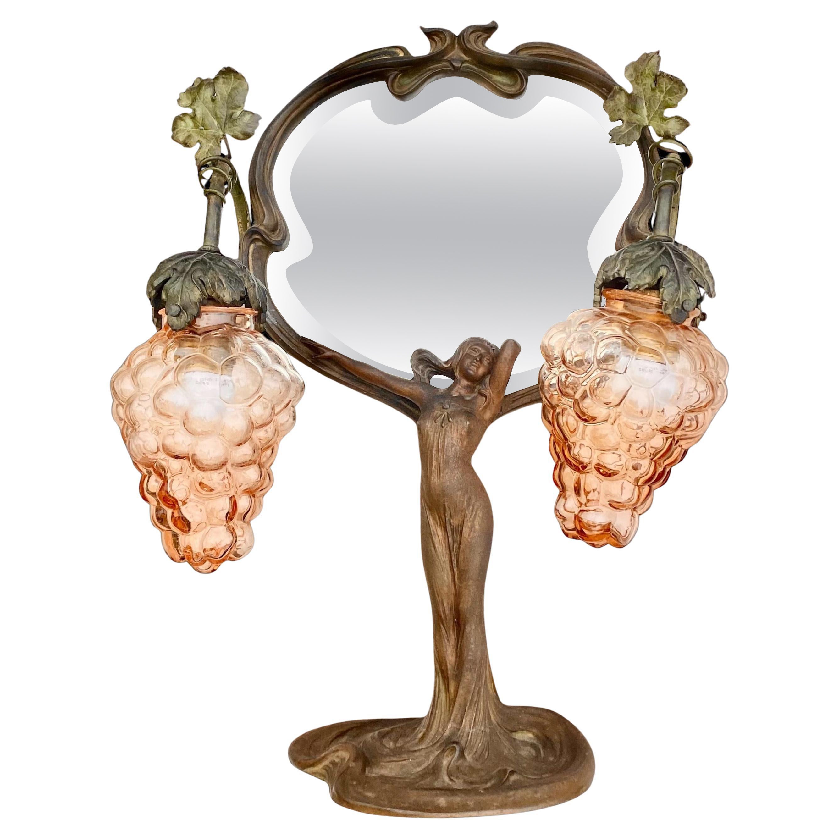 A Period French Art Nouveau Lighted Figural Beveled Vanity Mirror For Sale