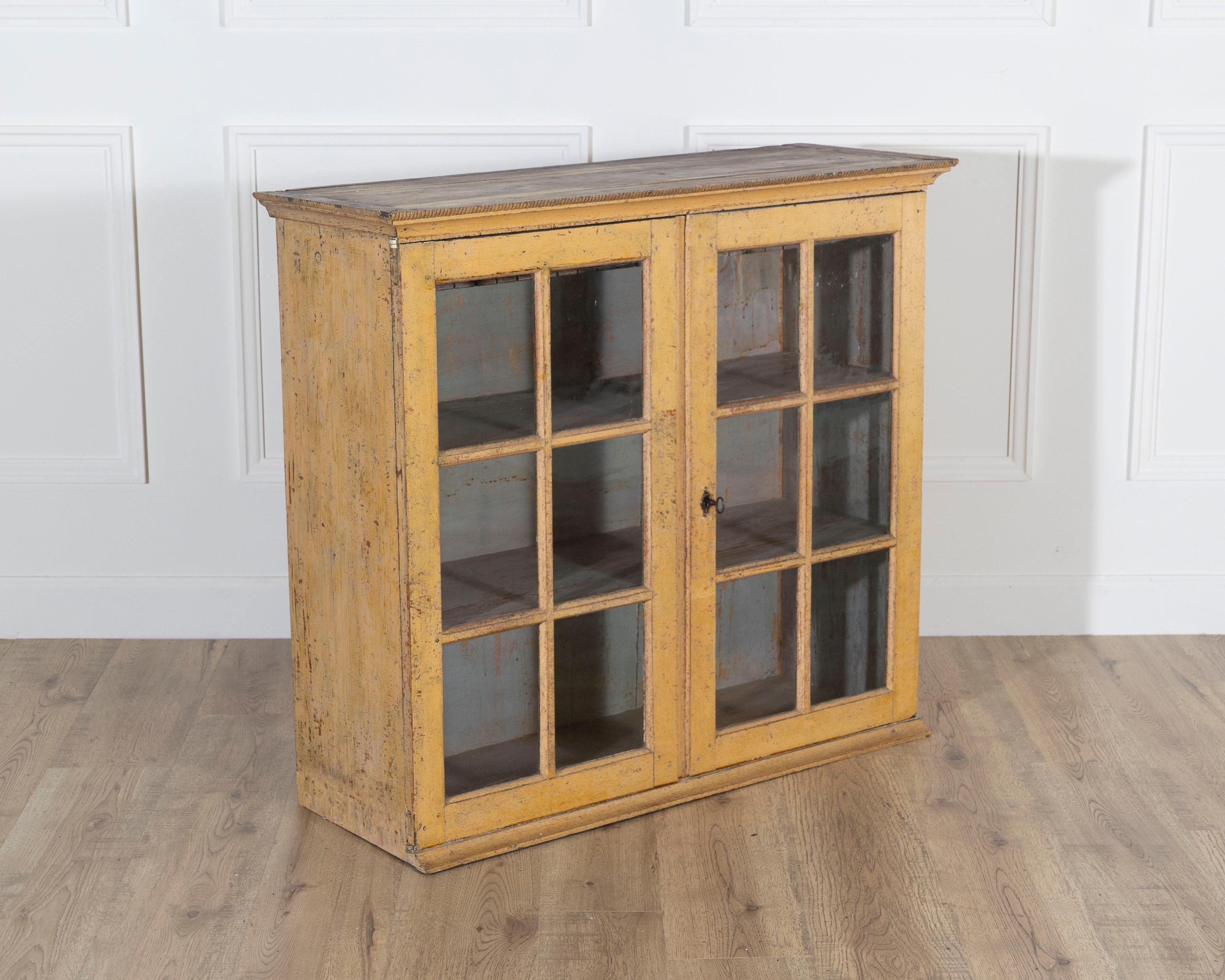 Painted A period gustavian wall cabinet with glossed doors scraped to original paint For Sale