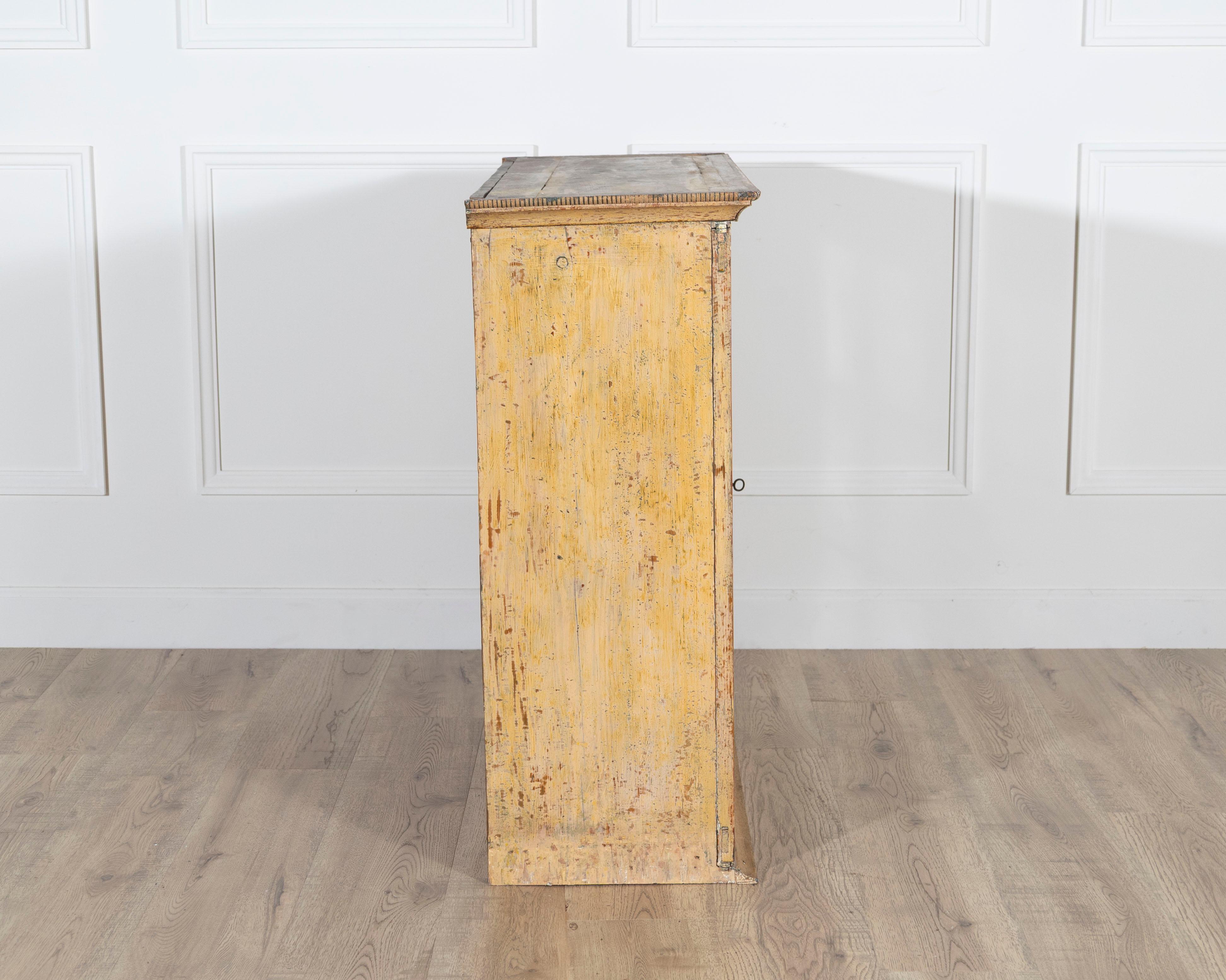 A period gustavian wall cabinet with glossed doors scraped to original paint In Good Condition For Sale In Atlanta, GA