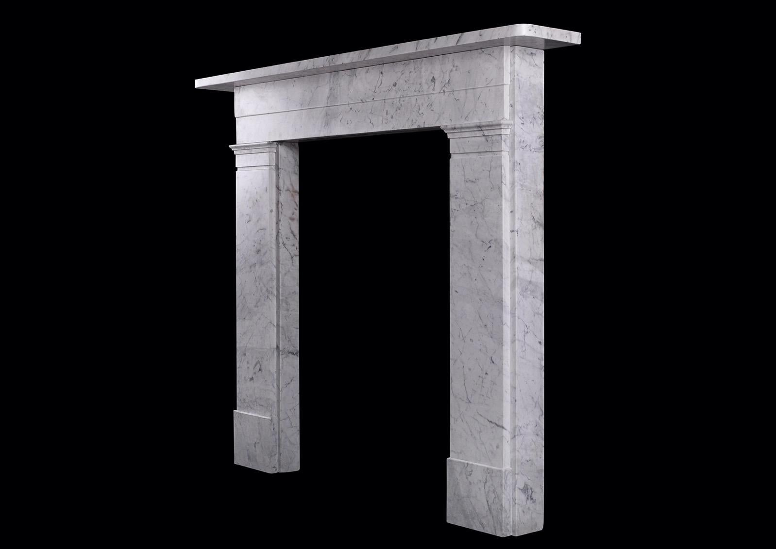A period Victorian marble fireplace in Italian Carrara marble. The flat jambs surmounted by stepped frieze with plain shelf above. English, mid 19th century. A smaller version of Stock No. 4191.

Measures: Shelf width: 1366 mm 53 ¾
