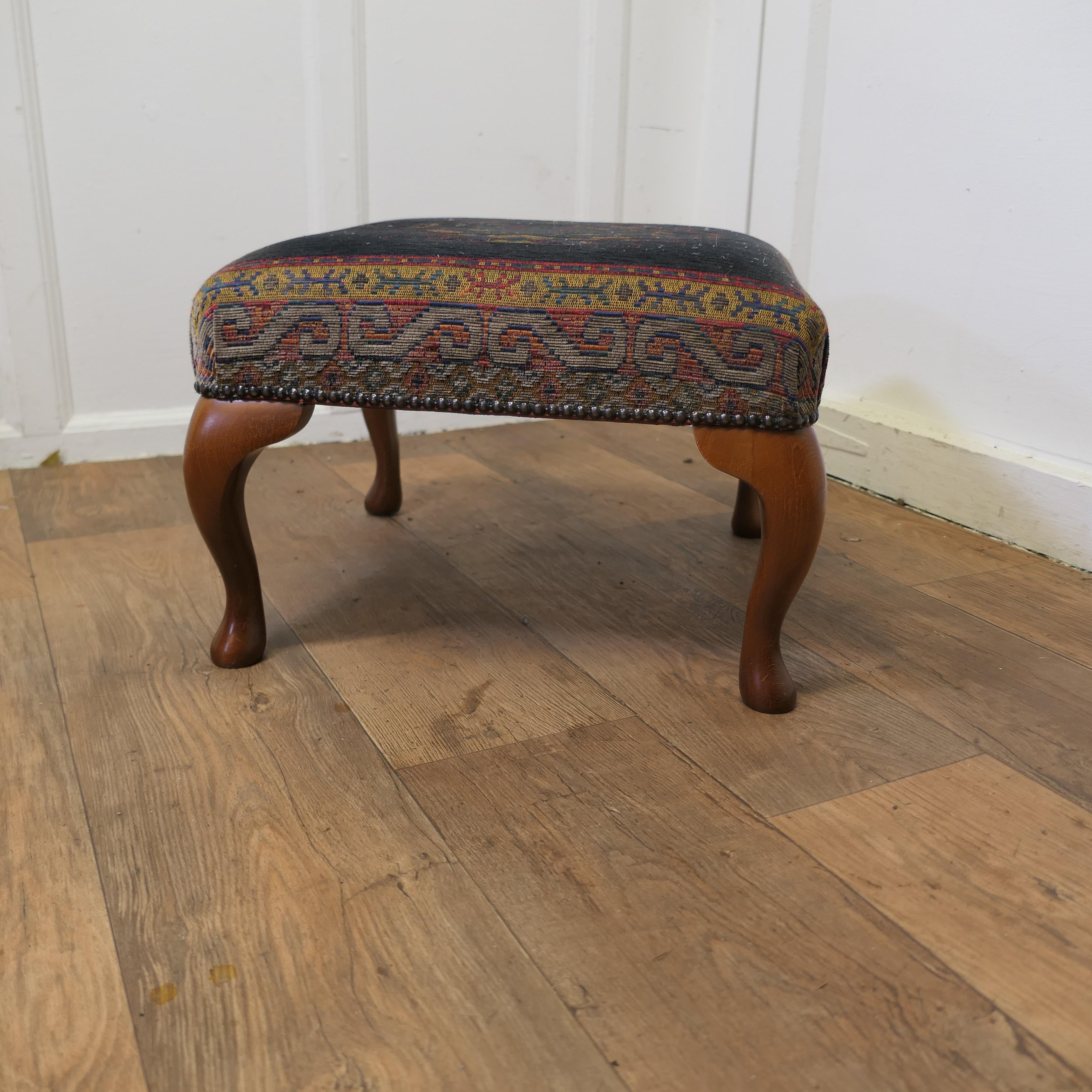 A Petit Point Embroidered Tapestry Upholstered Stool

A Lovely piece, the stool has a geometric designed embroidered wool seat set on a dark blue background, it is set on walnut cabriole legs
The seat has a few signs of wear but it is in generally