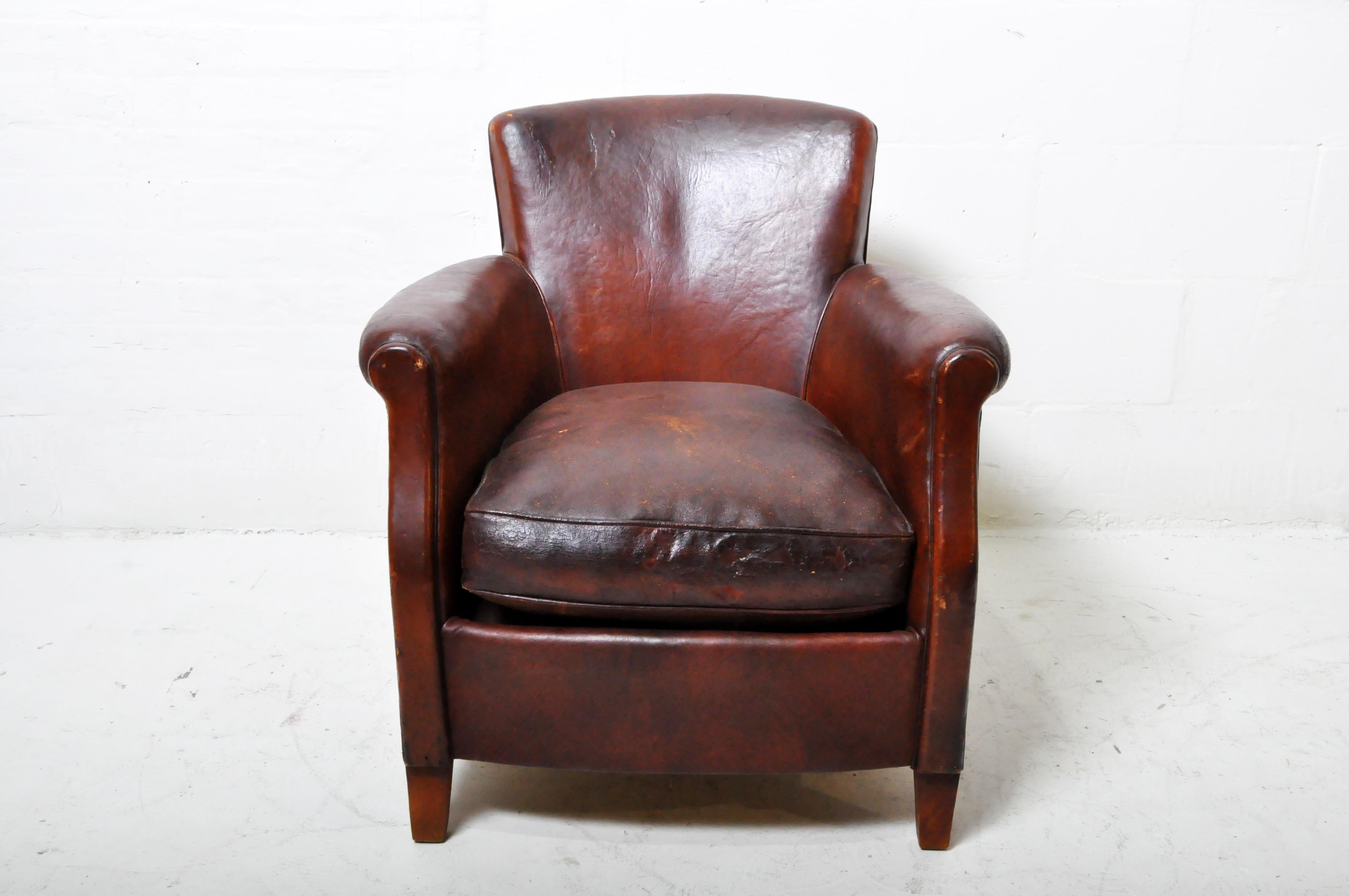 A rare smaller-framed French Art Deco club chair in sheep skin. The leather seat cushion is vintage but not original to the piece. Springs are in good condition and leather has only minor abrasions and imperfections.