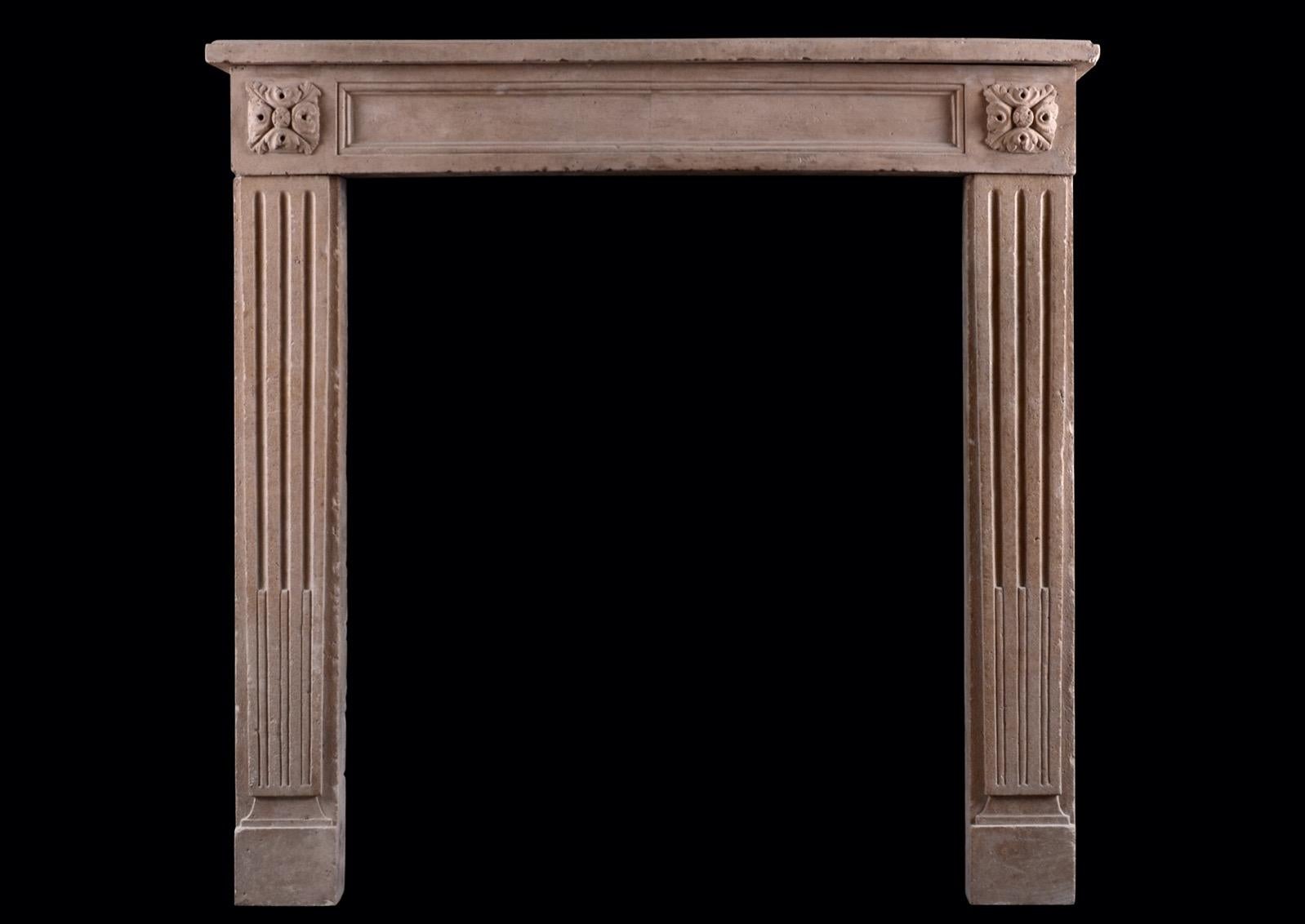19th Century Petite French Limestone Fireplace in the Louis XVI Manner For Sale