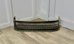 A Petite Victorian Pierced Brass and Iron Fender