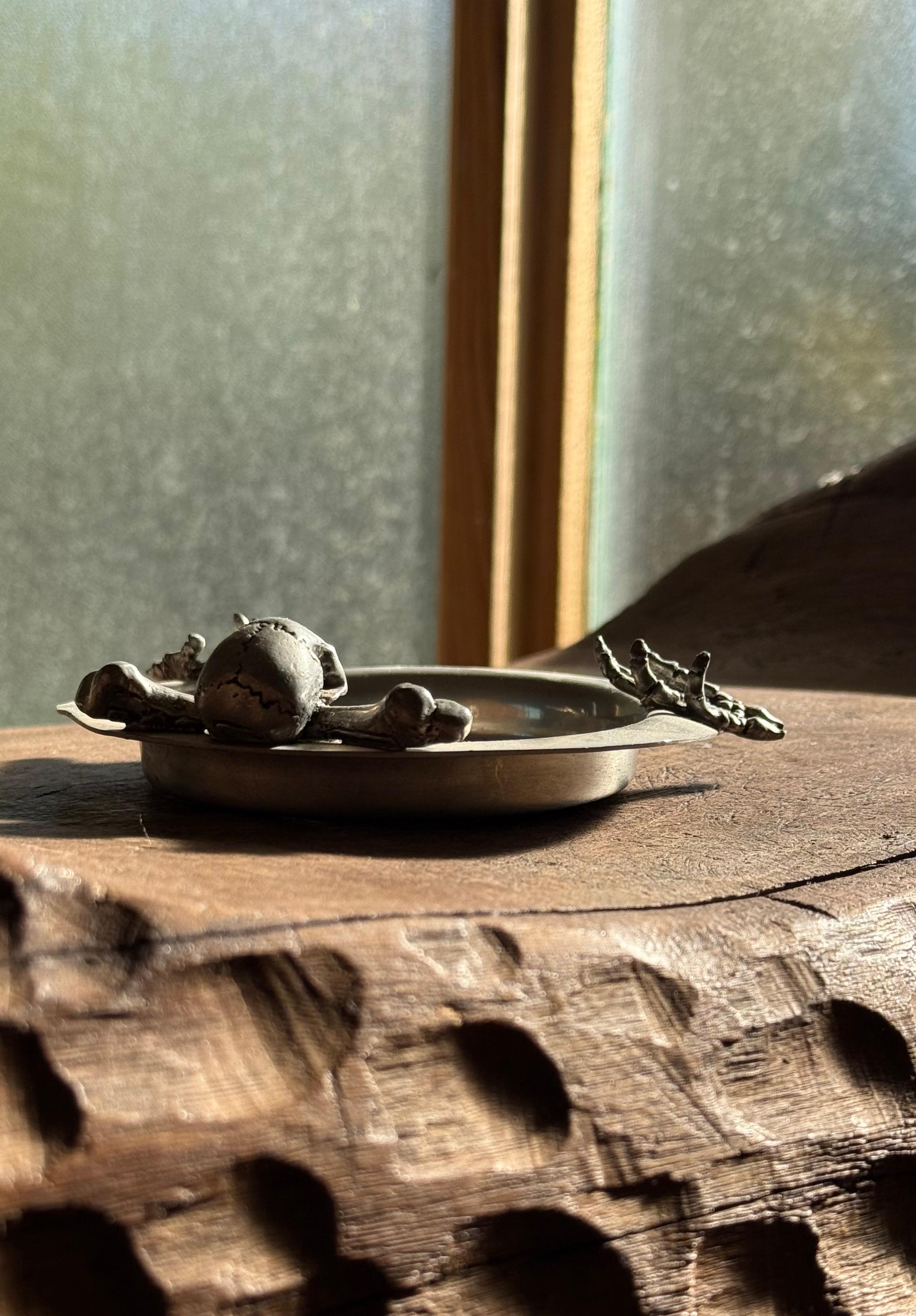 20th Century A pewter ashtray ft. skeleton skull and crossbones by Alchemy, 20th century For Sale