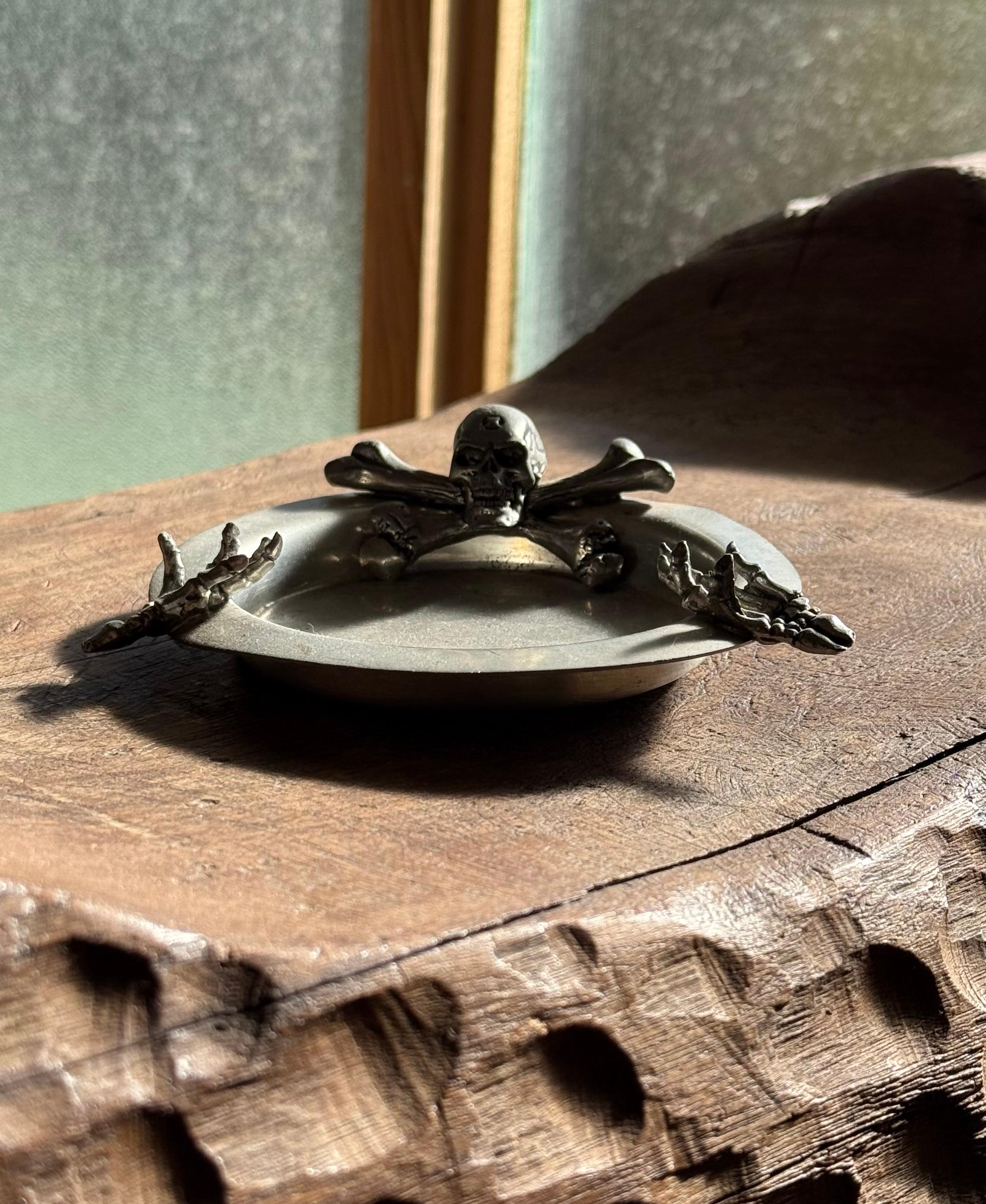 Pewter A pewter ashtray ft. skeleton skull and crossbones by Alchemy, 20th century For Sale
