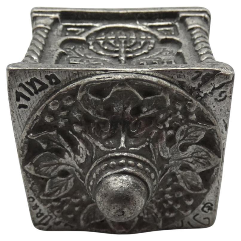 A Pewter Bezalel Dreidel made by Moshe Murro, Jerusalem 1929

Moshe Murro (1888-1957), was one of the greatest artists of Bezalel and Israeli art-designers. He set up an Amulet workshop to restore old ivory or stone amulets at the Bezalel Academy of