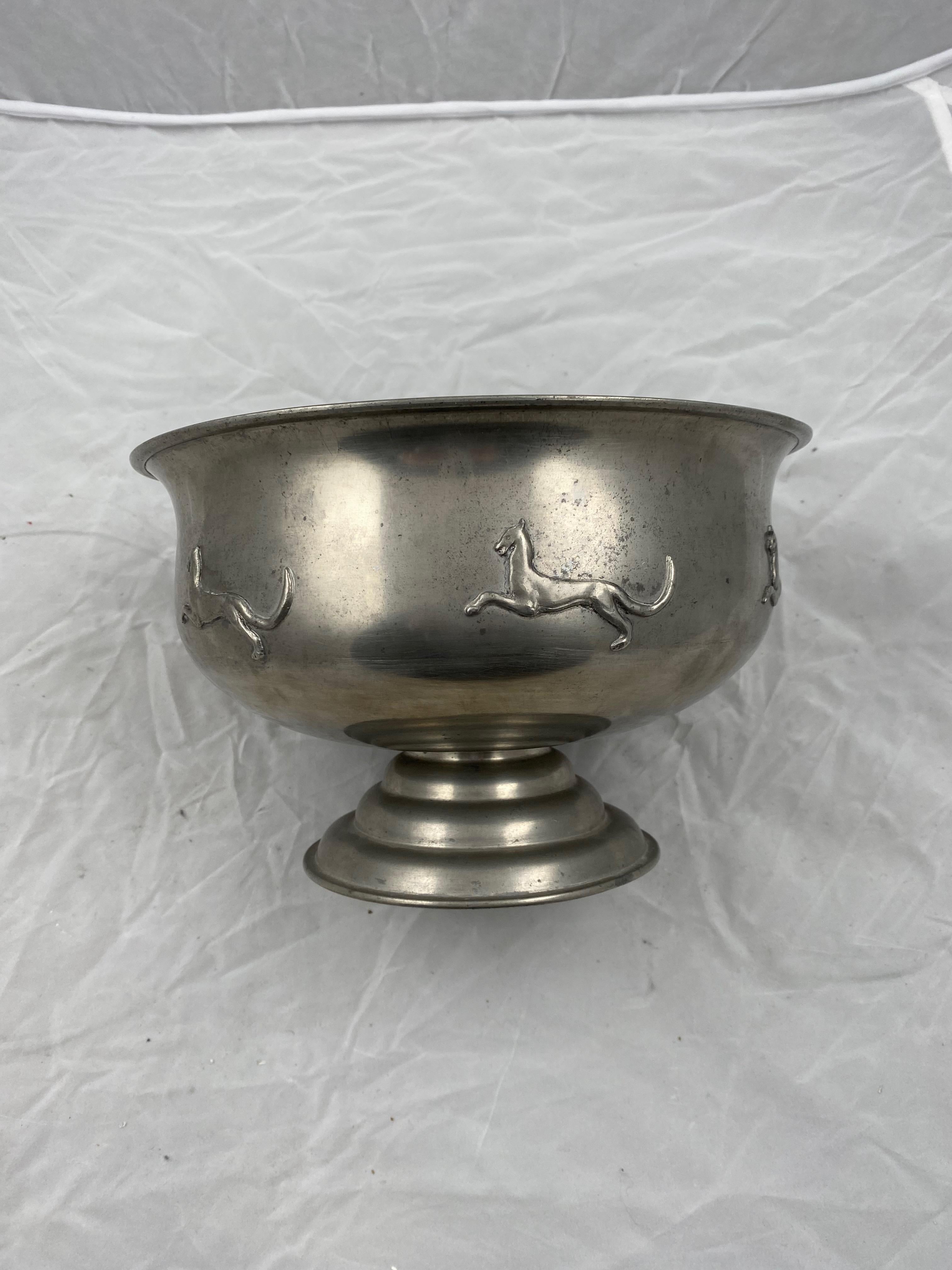 A large pewter bowl made by the company Svenskt Tenn, 1928. With decorations of running lions. Swedish grace.
